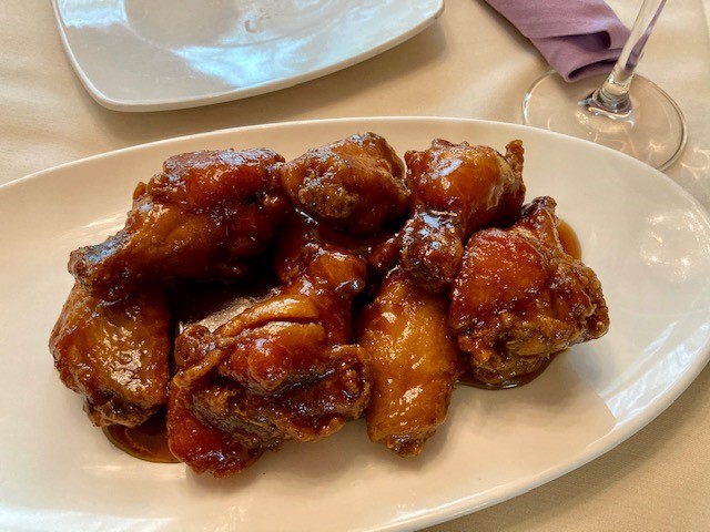 Order 8 Pieces Sticky Chicken Wings with Oyster Sauce food online from Jacky's Galaxie Restaurant store, Providence on bringmethat.com