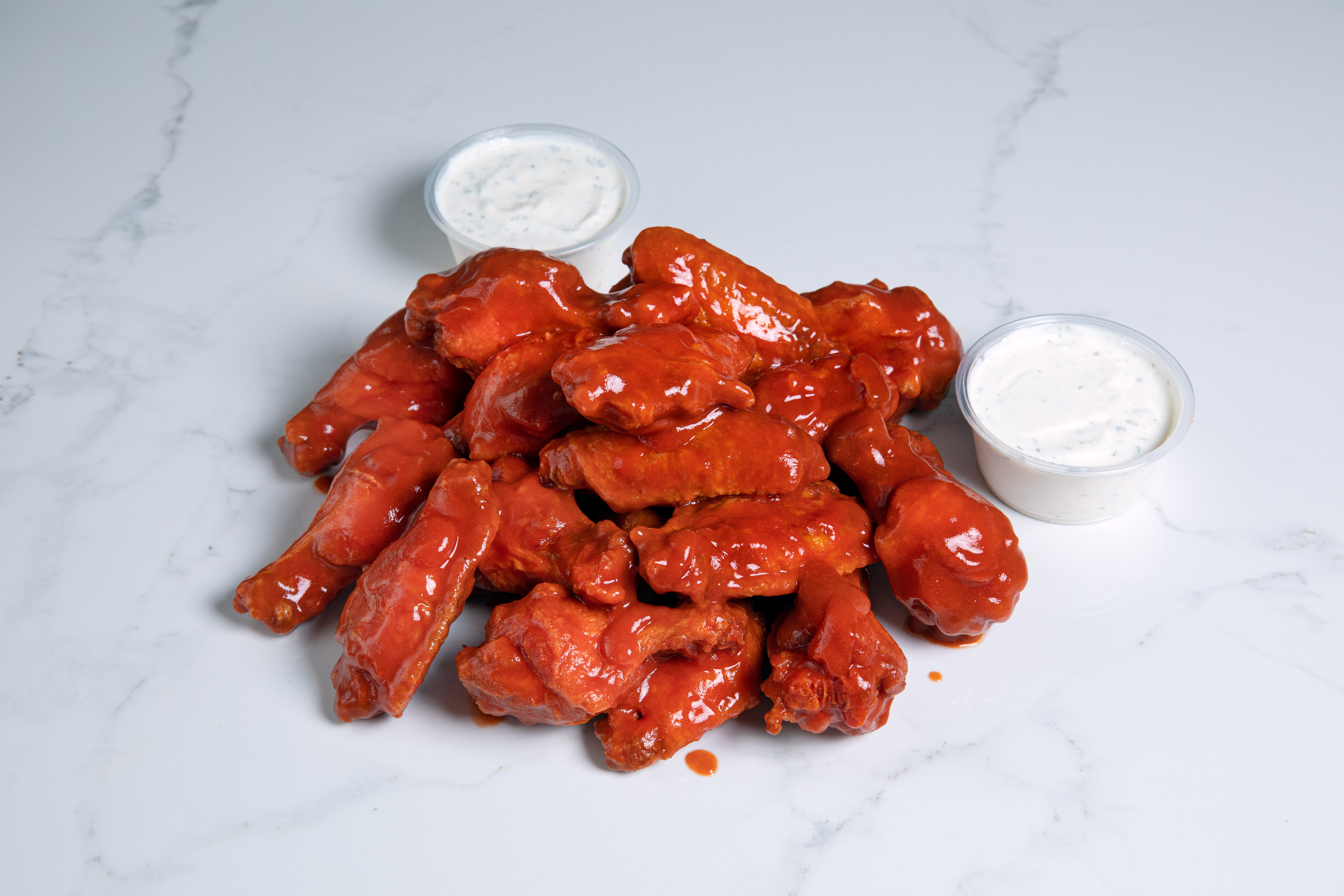 Order Wings • 20pc food online from Cluckin Bun store, cathedral city on bringmethat.com