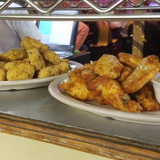 Order Medium Bone-In Wings food online from Pisanellos Pizza store, Bowling Green on bringmethat.com