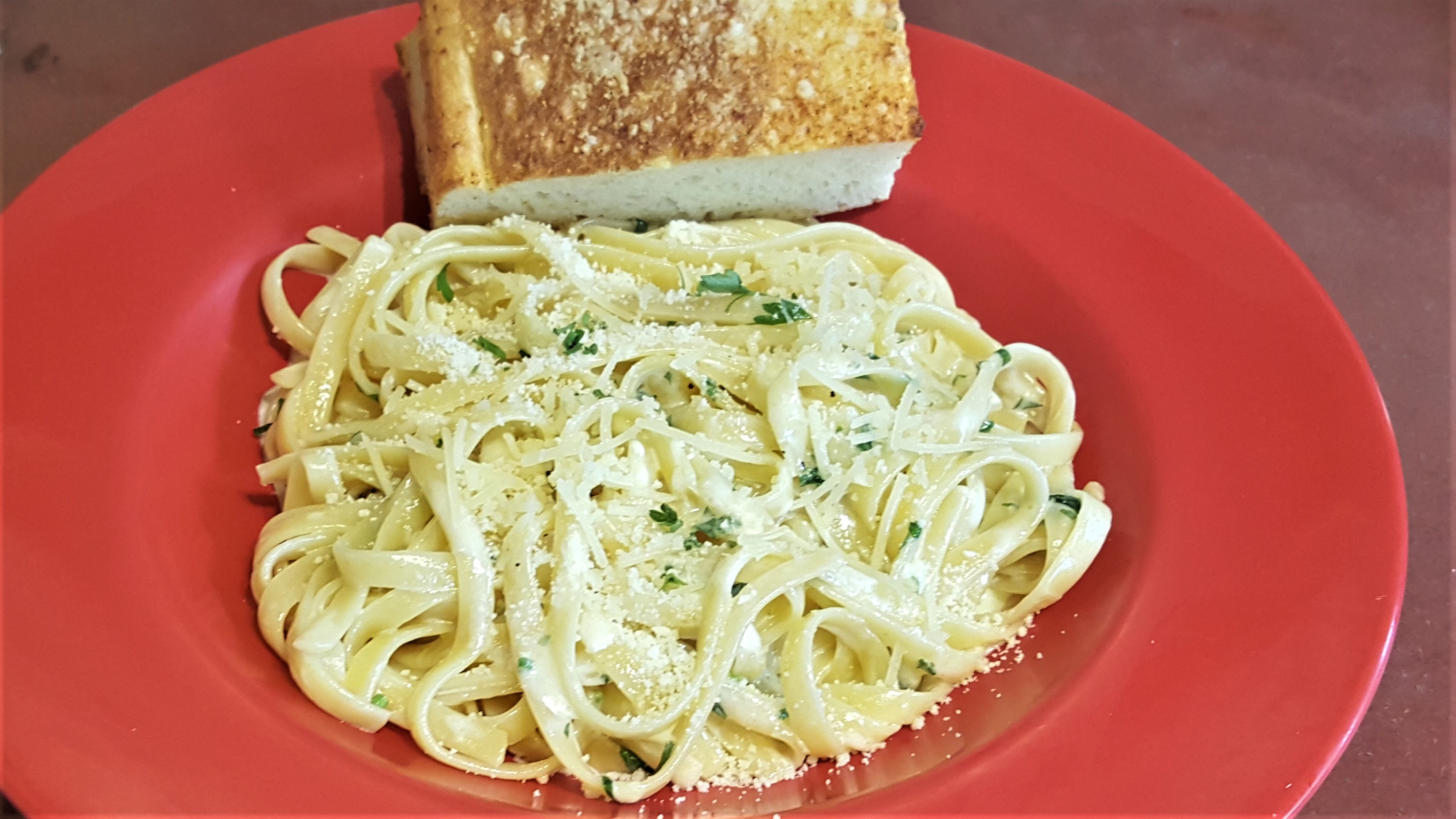 Order Fettuccini Alfredo food online from Primo Pizza & Pasta store, Carlsbad on bringmethat.com