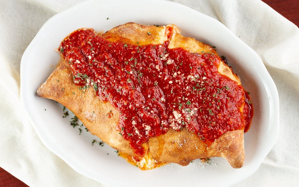Order Calzone - Calzone food online from Three Brothers Italian Restaurant store, Prince Frederick on bringmethat.com
