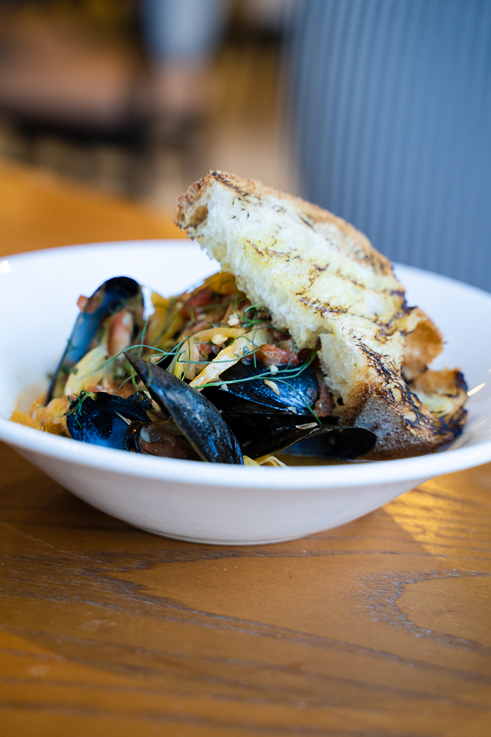 Order Bouillabaisse Mussels food online from Teddy & The Bully Bar store, Washington on bringmethat.com