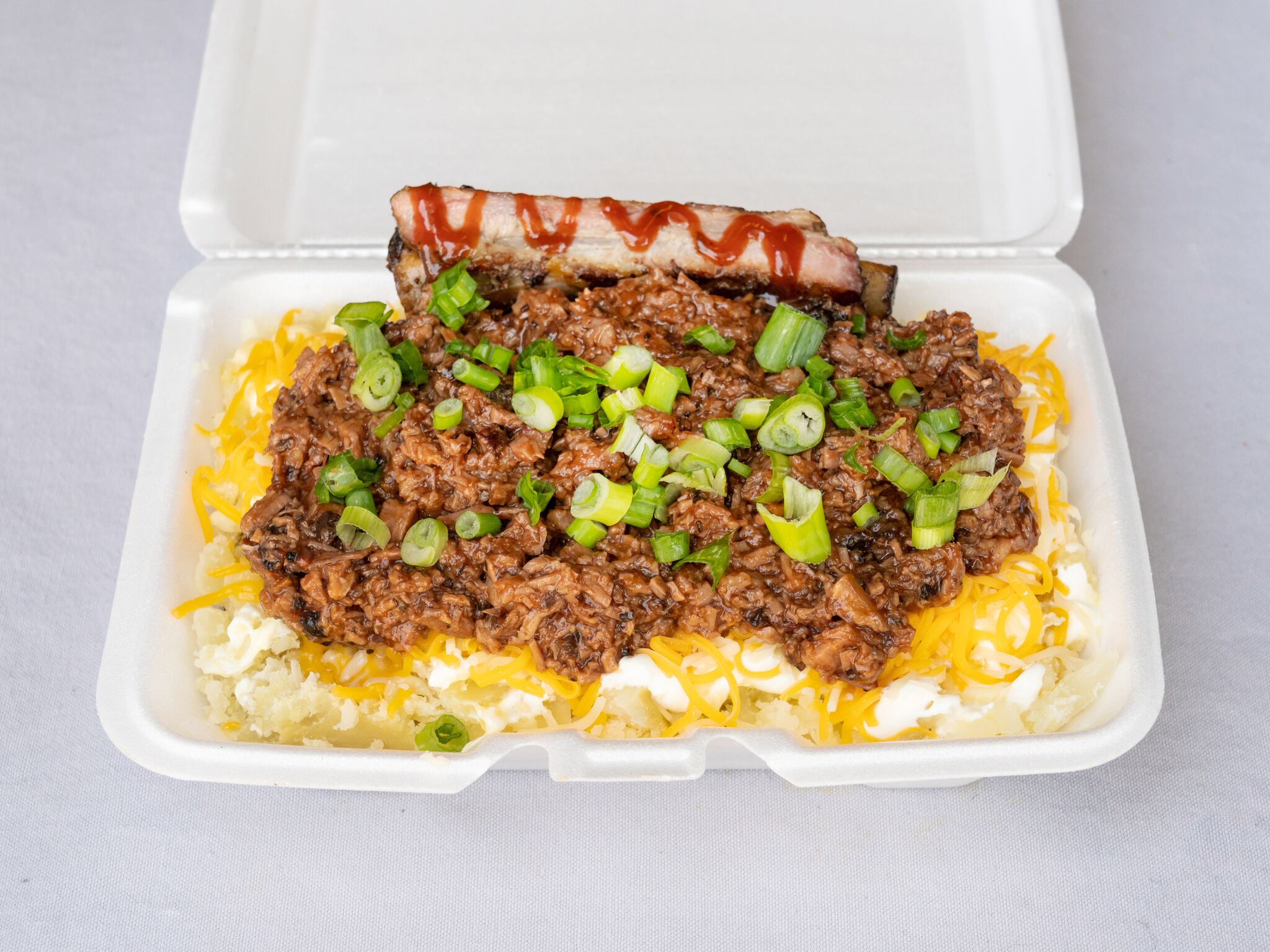Order Brisket Loaded Potatoes food online from Guillorys Bar B Que store, Houston on bringmethat.com