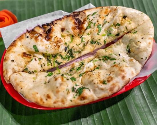 Order Garlic Naan food online from Suprabhat store,  Austin on bringmethat.com