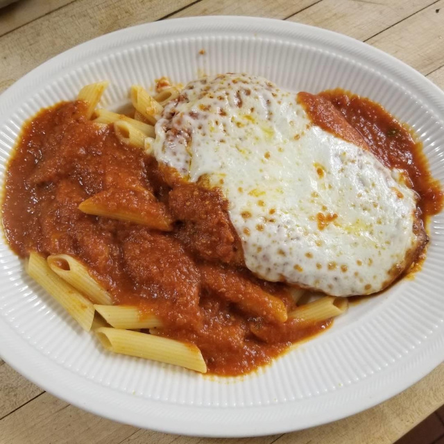 Order Breast of Chicken Parmigiana food online from A Touch of Italy store, Egg Harbor Township on bringmethat.com