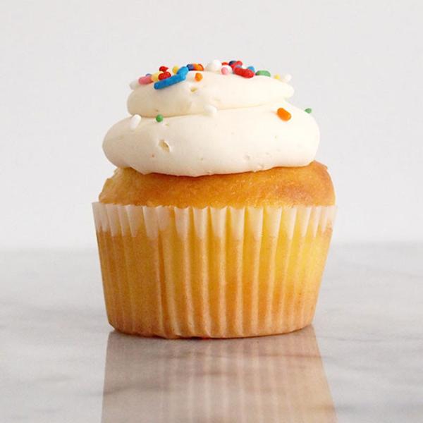 Order Vanilla Cupcake with Vanilla Buttercream food online from Baked Cravings store, New York on bringmethat.com