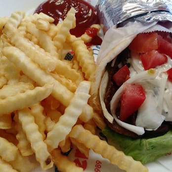Order 2 Beef Gyros on Pita Special food online from Vino's Pizzeria store, Greensboro on bringmethat.com