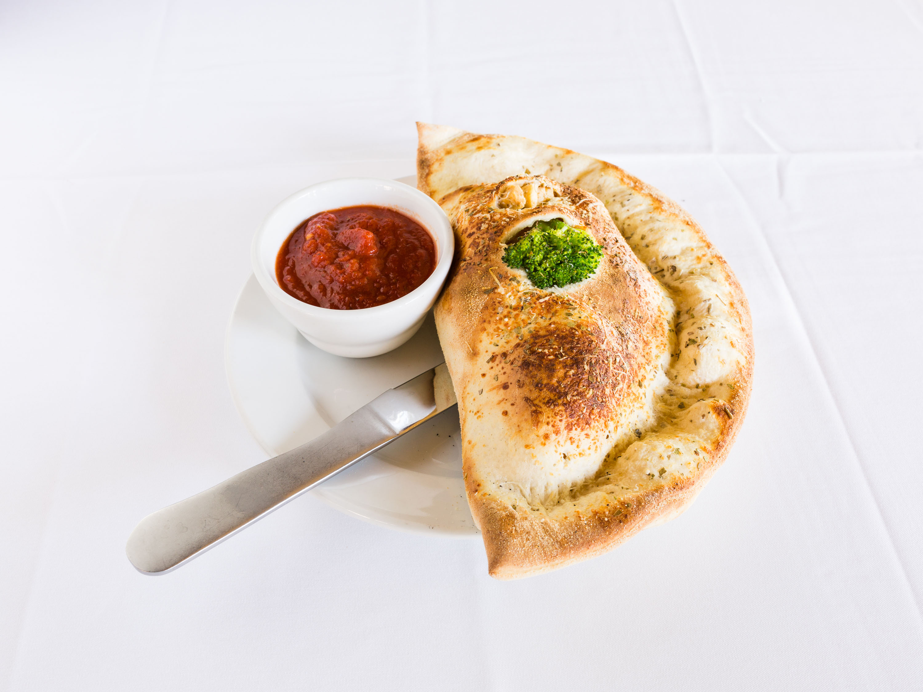 Order Chicken, Broccoli and Cheddar Calzone food online from Trio A Brick Oven Cafe store, Greenville on bringmethat.com