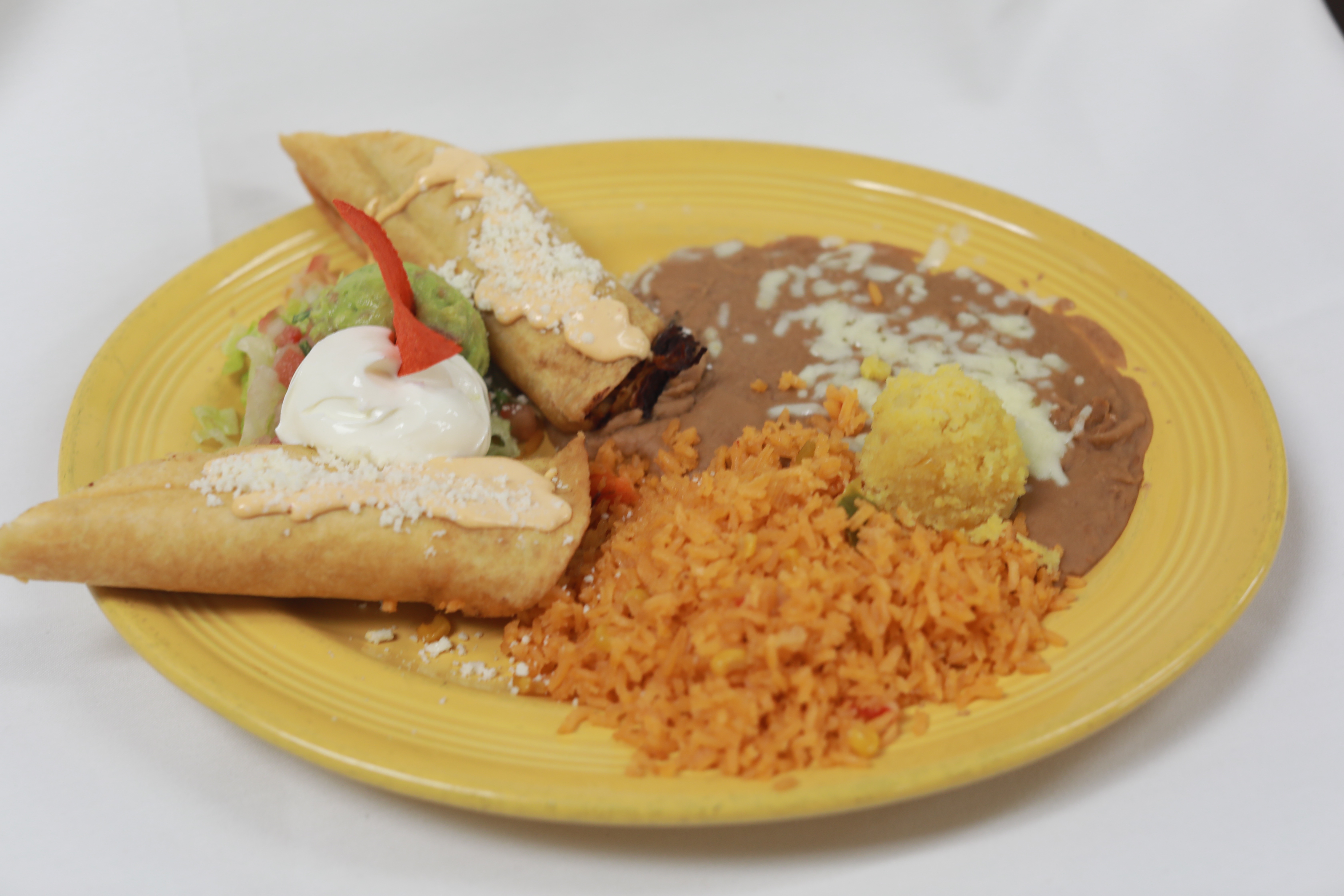 Order Two Chicken Flautas Almuerzo food online from El Tapatio store, Citrus Heights on bringmethat.com