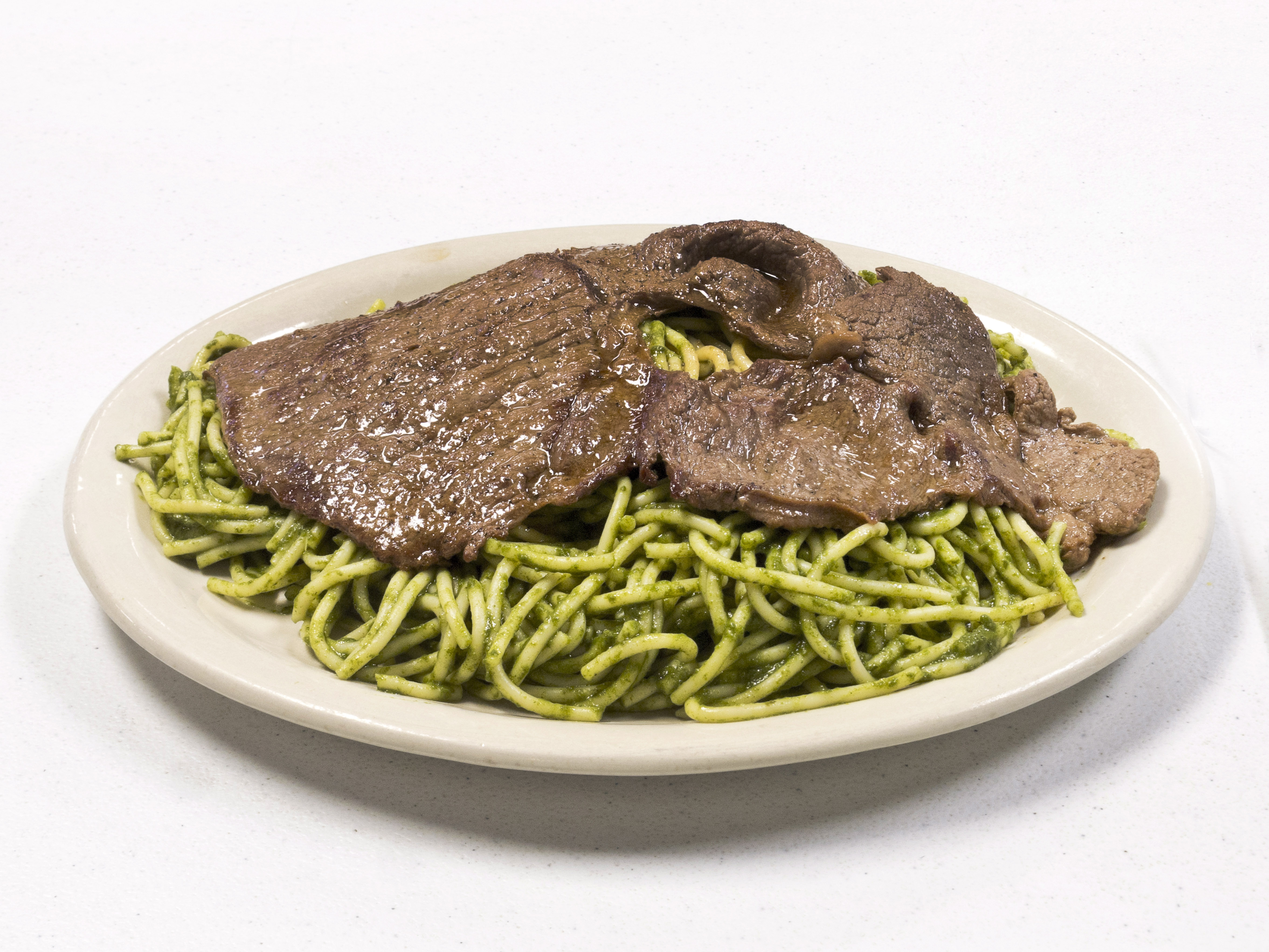 Order Tallarines Verdes con Bistec food online from Tineo Peruvian Cafe store, Richardson on bringmethat.com