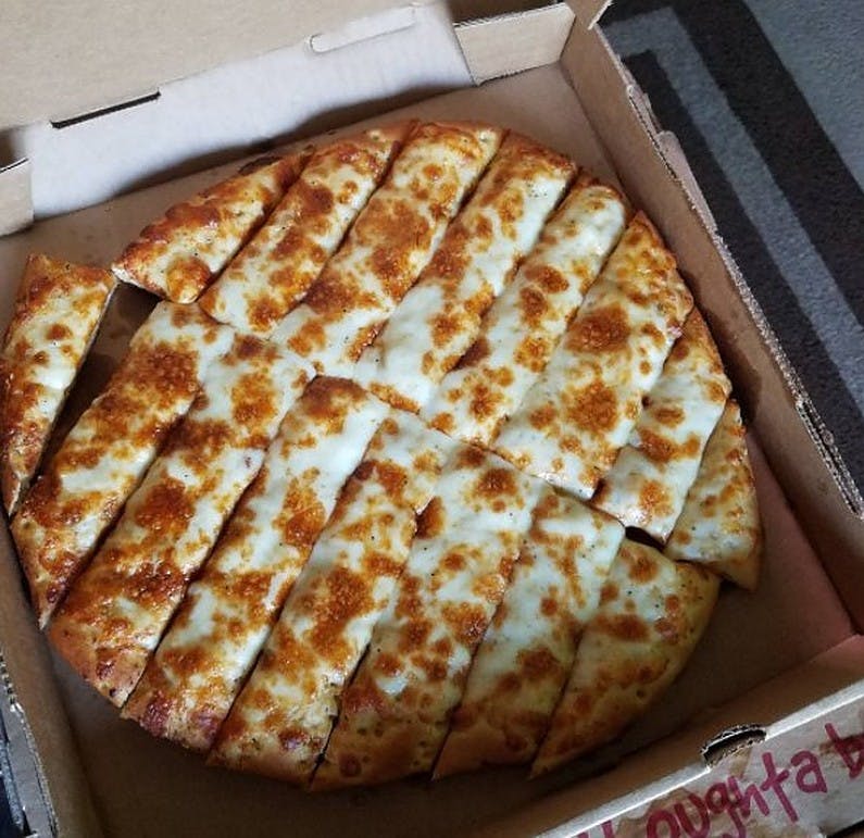 Order Garlic Sticks with Cheese - Small (12 Pieces) food online from Mountain Mike Pizza store, Hercules on bringmethat.com