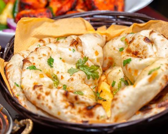Order Butter Naan (1pc) food online from Aroma Indian Restaurant store, Bloomington on bringmethat.com