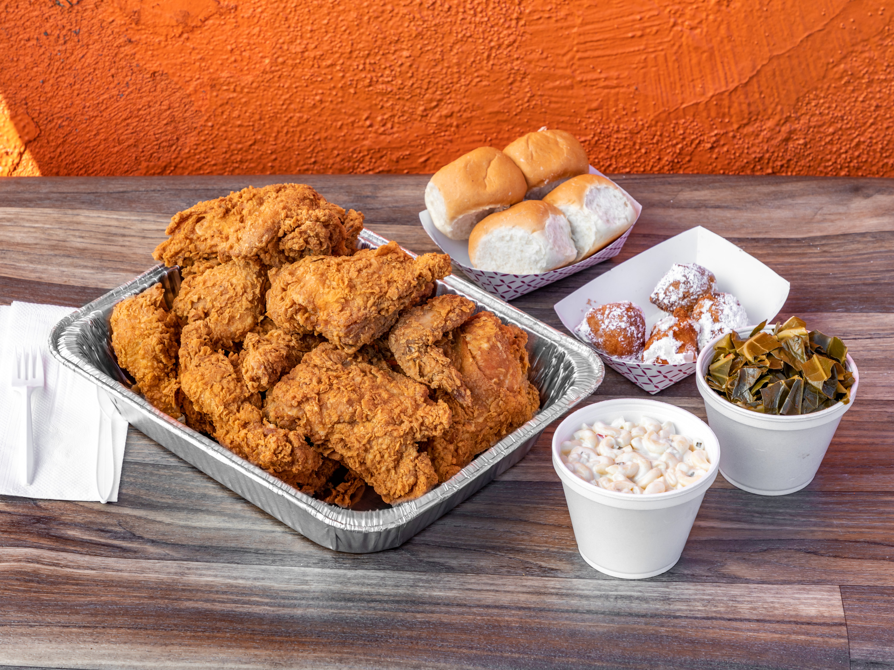 Order 12 Piece Chicken , 2 Large Sides, 4 rolls food online from Charlie Famous Fried Chicken store, Los Angeles on bringmethat.com
