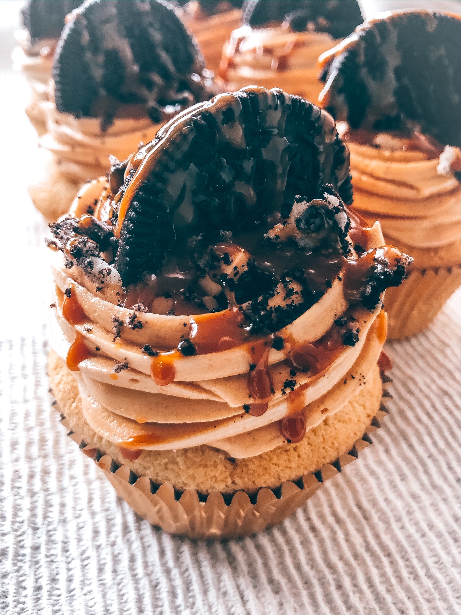 Order Dulce Leche Oreo Cupcake  food online from It Started With A Cupcake store, Lyndhurst on bringmethat.com