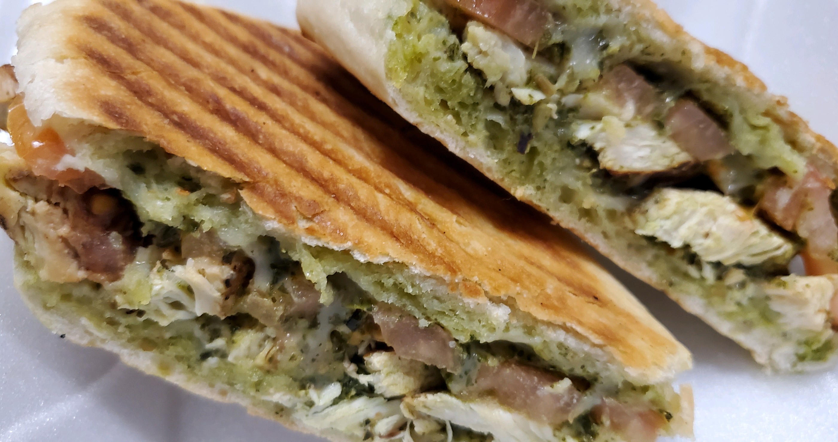 Order Pesto Chicken Panini food online from Knuckles Knockout Grill store, Rochester on bringmethat.com