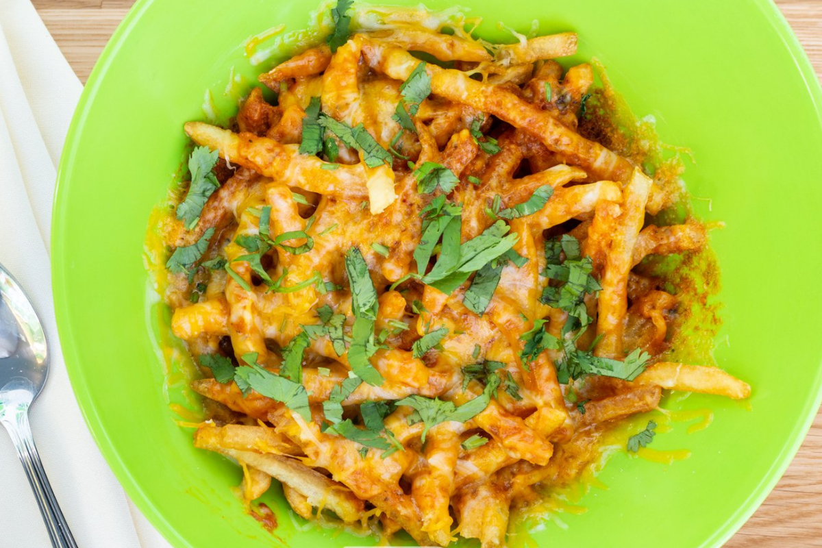 Order 41. Loaded Makhani Fries food online from Tulsi Indian Eatery store, Los Angeles on bringmethat.com