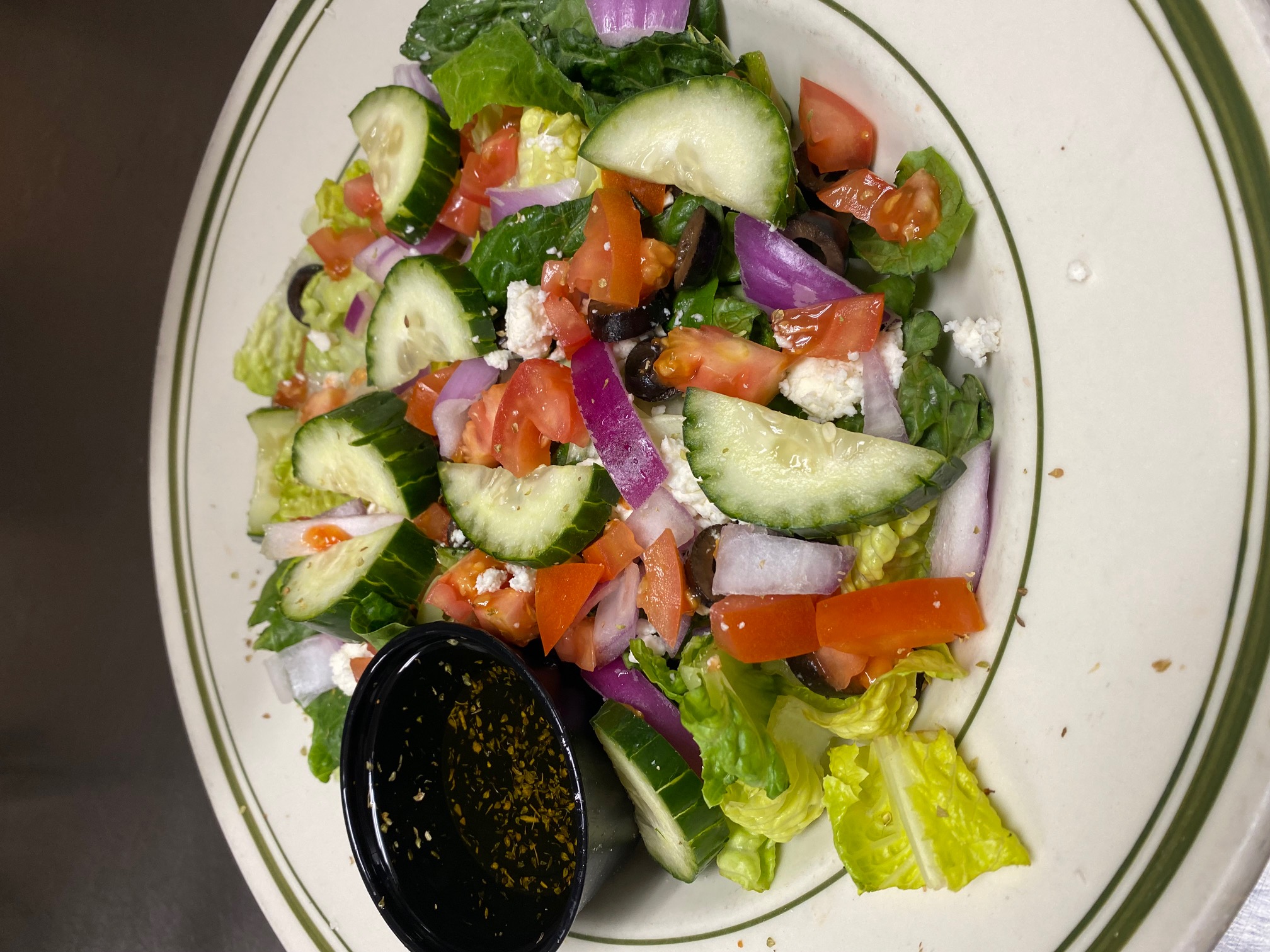 Order Greek Salad food online from Beggars Pizza store, Blue Island on bringmethat.com