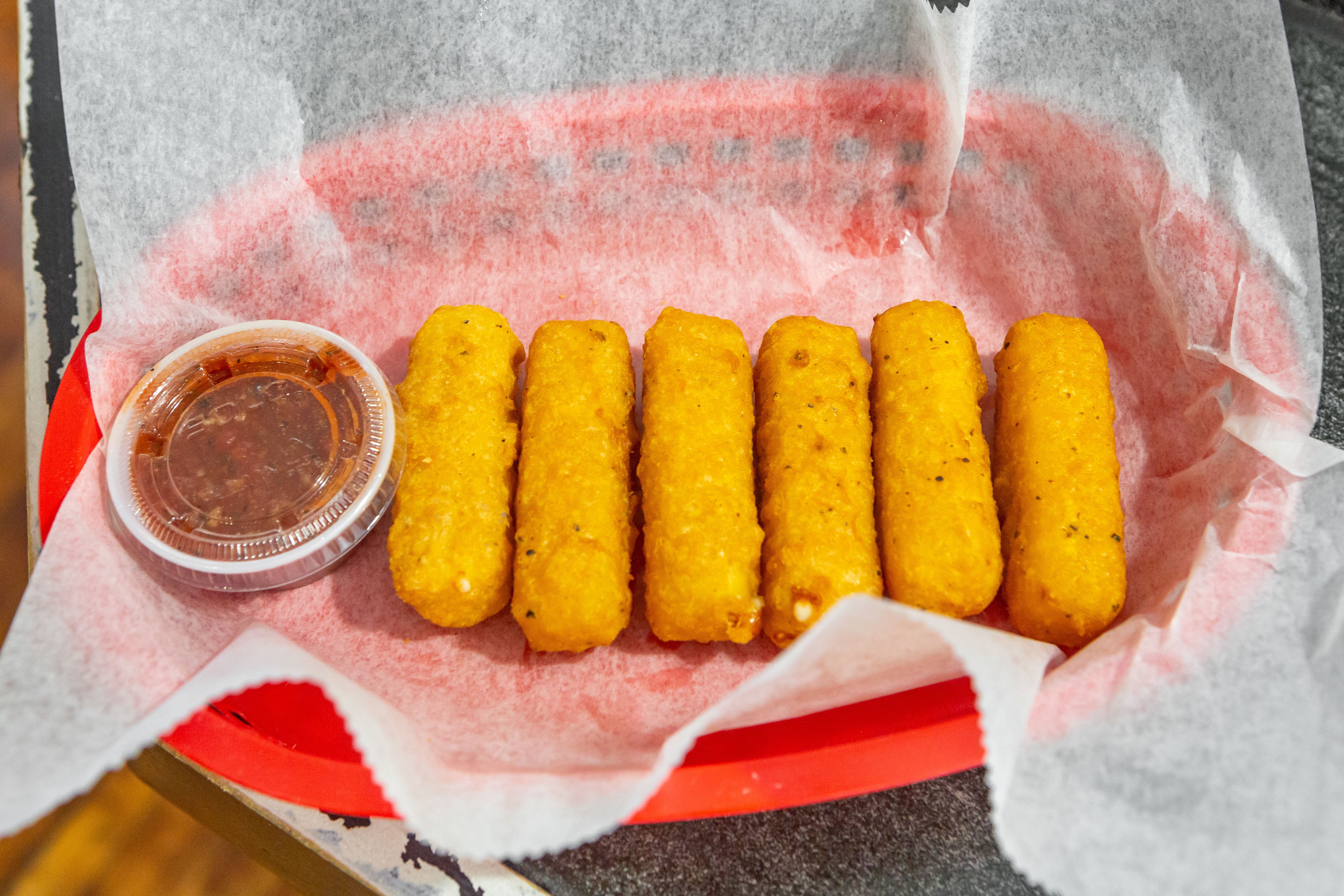 Order Mozzarella Sticks - 6 Pieces food online from Tangy Tomato store, Syracuse on bringmethat.com