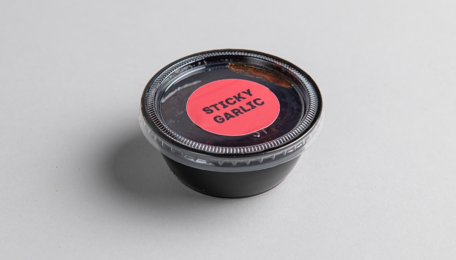 Order Sticky Garlic Sauce food online from Fedwings store, Gaithersburg on bringmethat.com