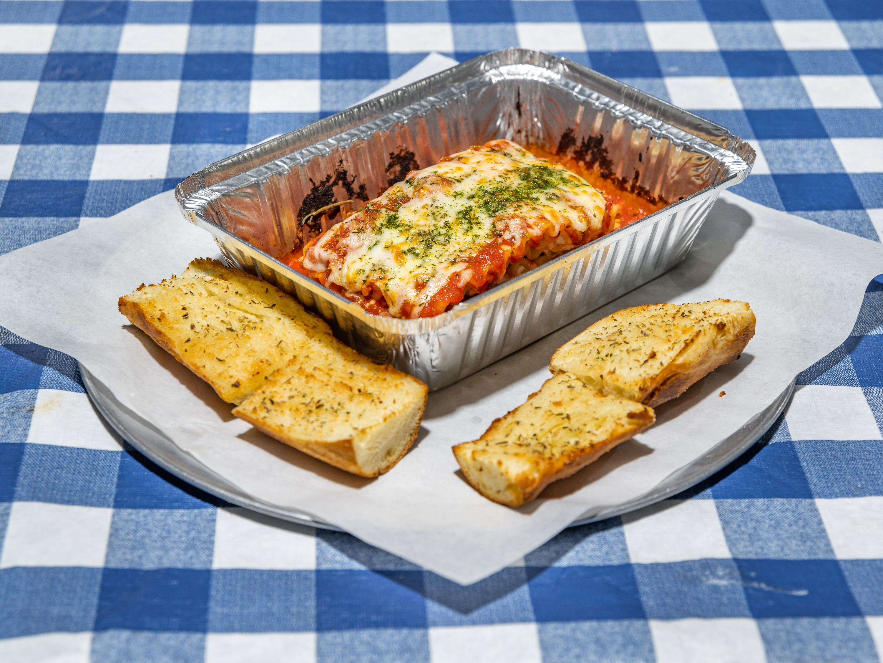 Order Meat Lasagna  food online from Topolino's Pizza store, Seattle on bringmethat.com