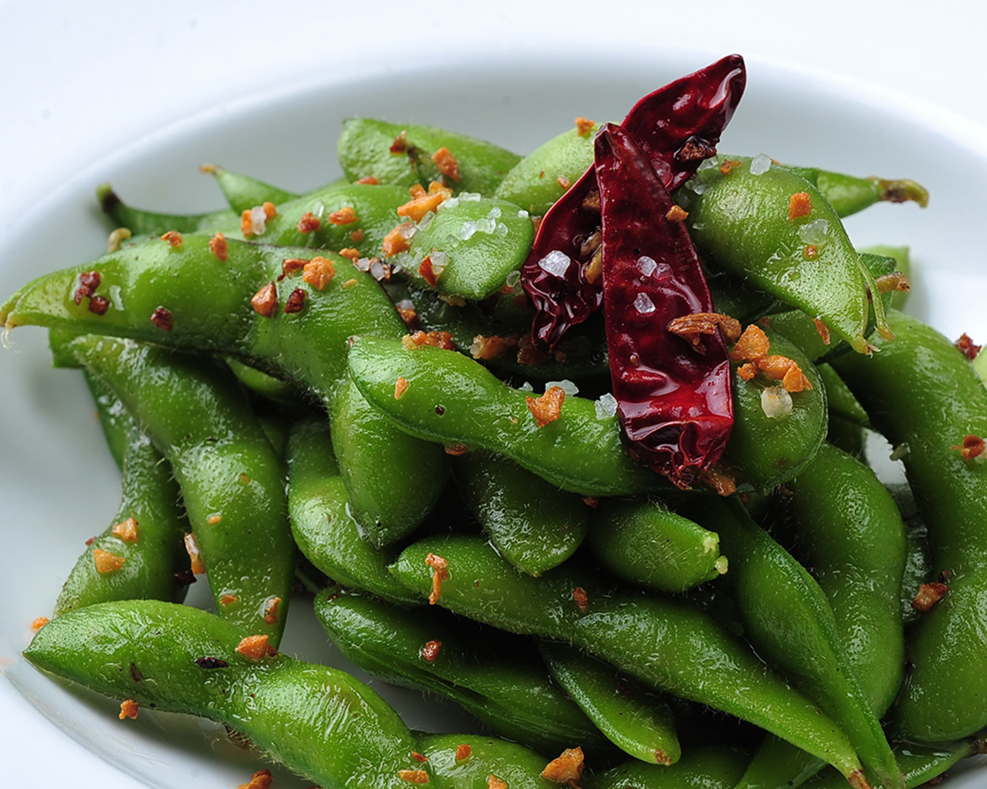 Order Garlic Edamame  food online from Kabuki Japanese Restaurant - Oxnard store, Oxnard on bringmethat.com