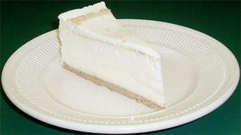 Order New York Cheesecake - Dessert food online from Primas Pasta & Pizza Restaurant store, Fort Worth on bringmethat.com
