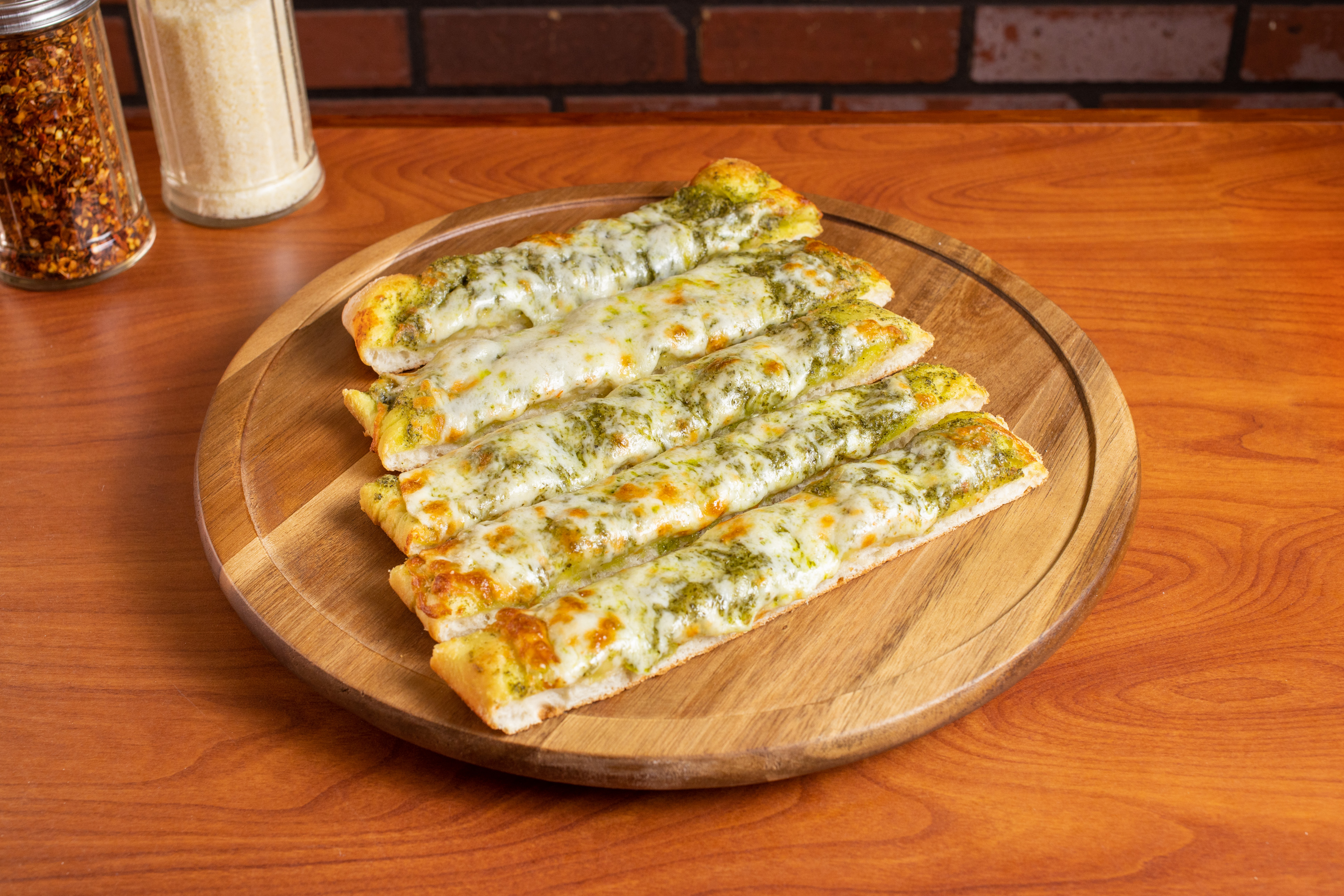 Order Cheesy Pesto Breadsticks food online from Sabrosa Pizza store, San Francisco on bringmethat.com