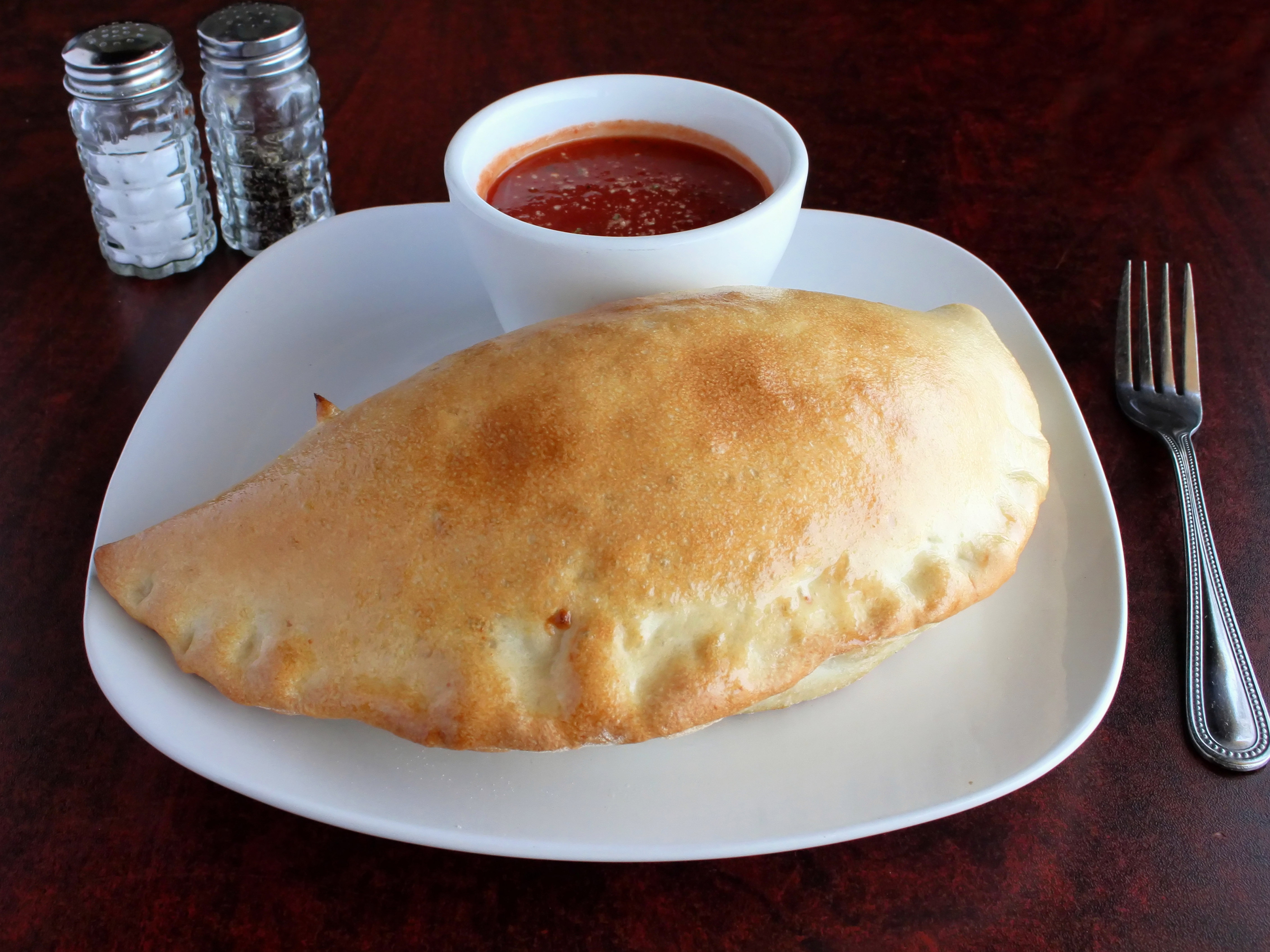 Order Cheese Calzone food online from Falcone Pizzeria store, Oklahoma City on bringmethat.com