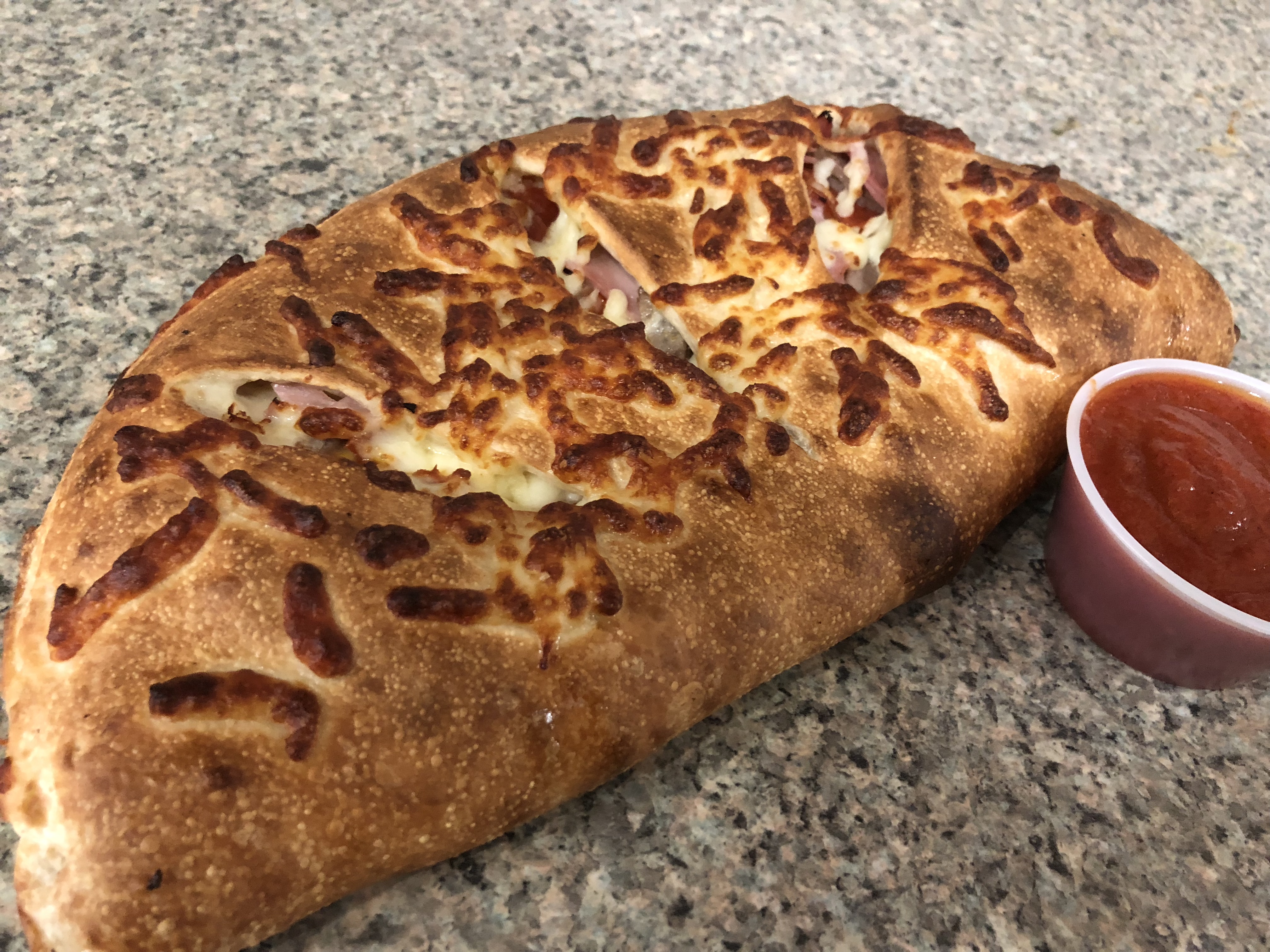 Order Meat Lovers Calzone food online from Andalus Pizza & Cafe store, Brighton on bringmethat.com