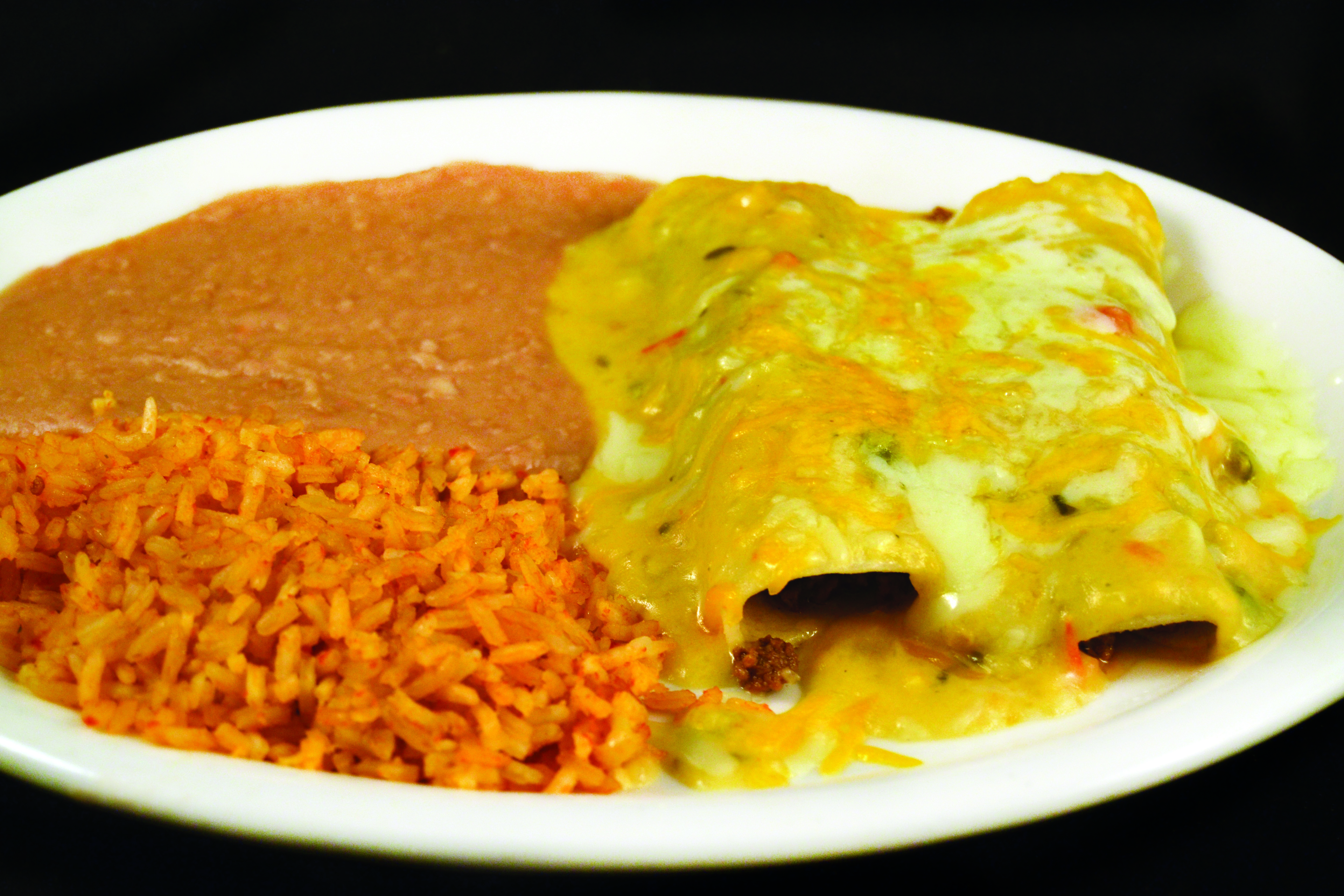 Order Chile con Queso Beef Enchiladas food online from Mi Comal Mexican Restaurant store, Irving on bringmethat.com