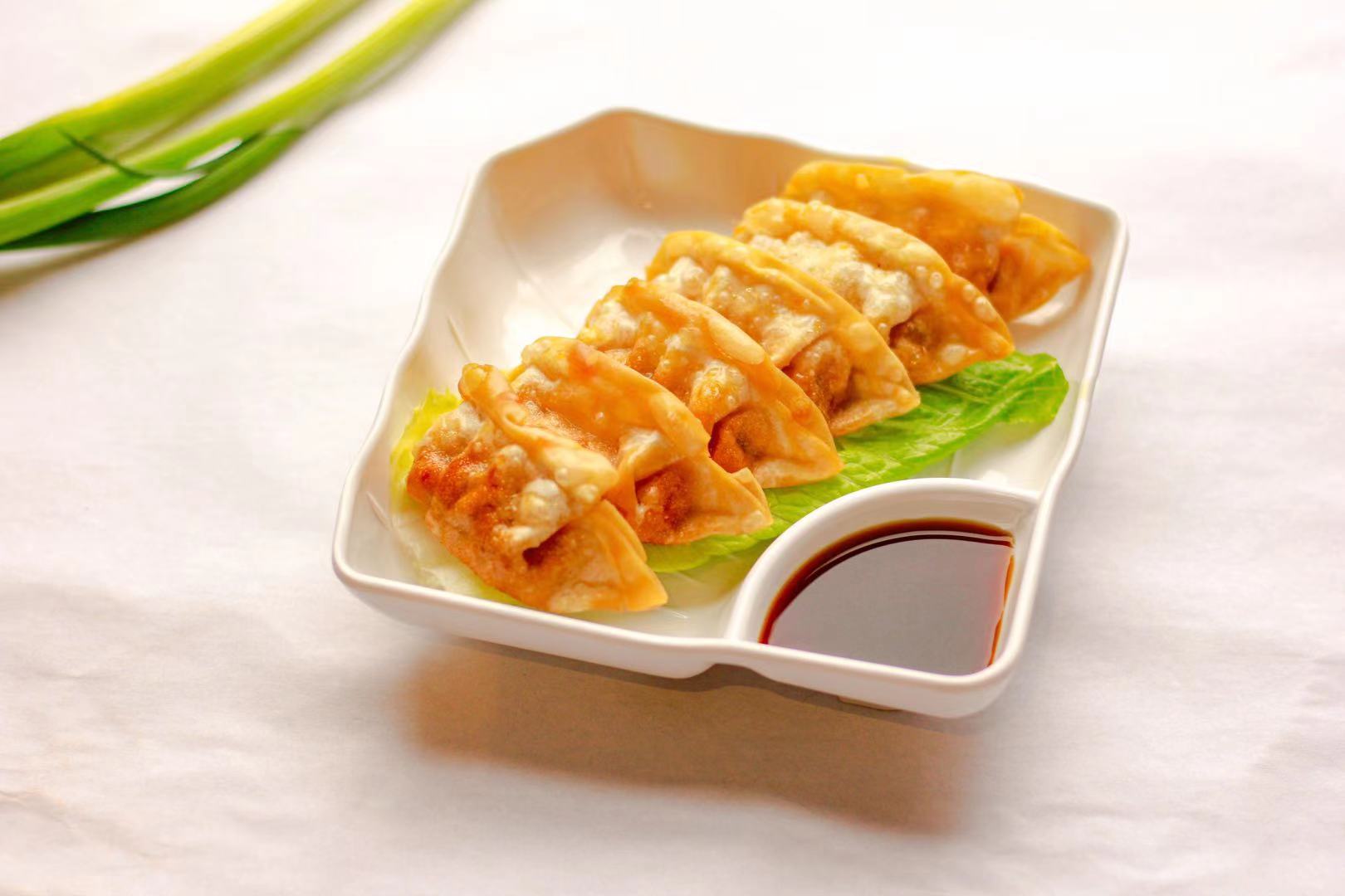 Order A2. Pot Sticker 锅贴 food online from Noodle & I store, West Lafayette on bringmethat.com