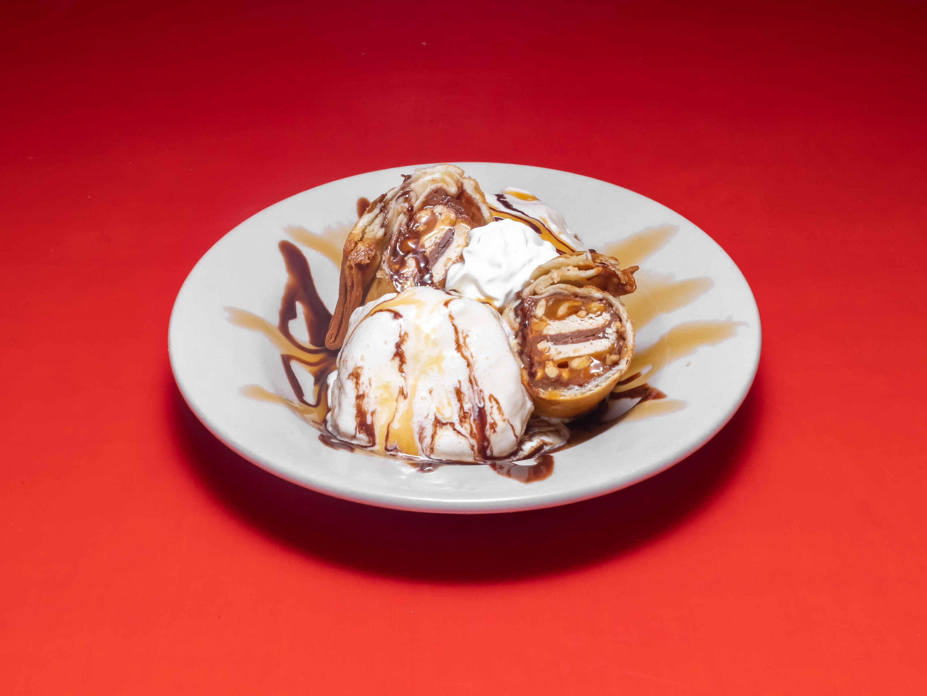 Order Fried Snickers food online from Wolfies Restaurants & Sports Bars store, Sugar Land on bringmethat.com