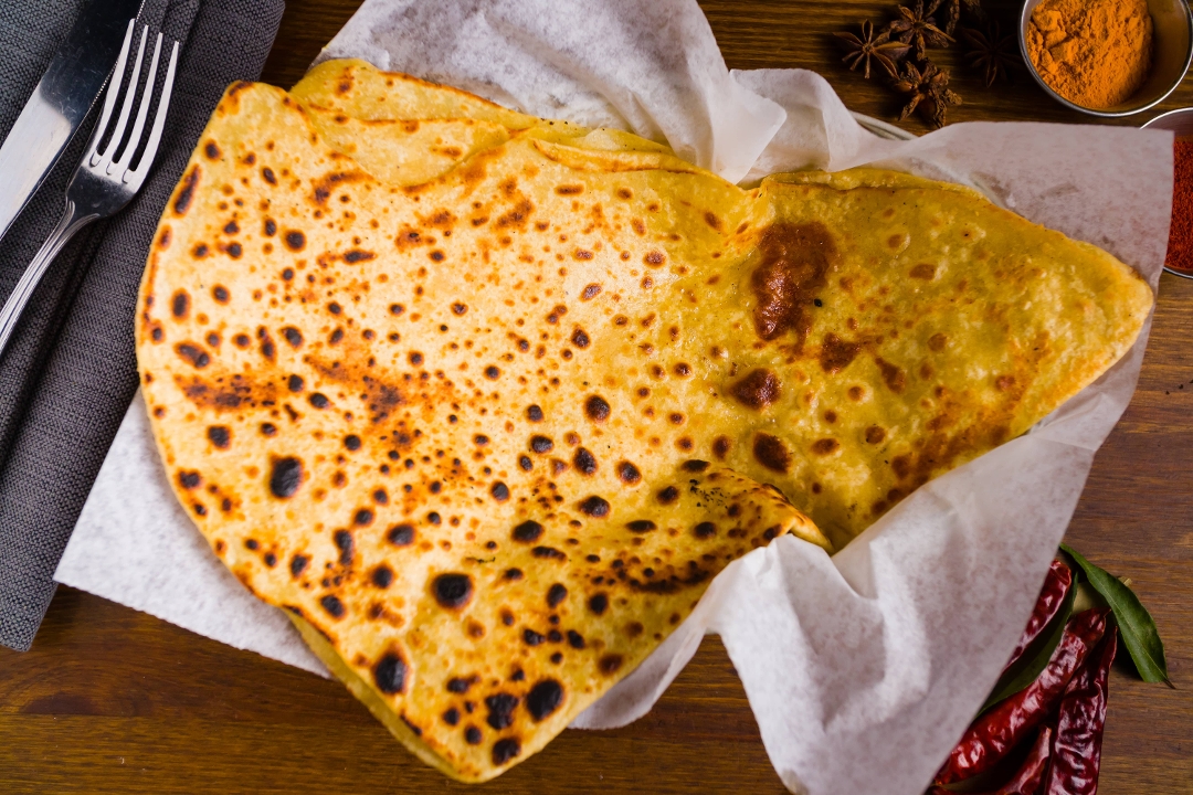Order Tawa Paratha food online from Dhaba indian cuisine store, New York on bringmethat.com