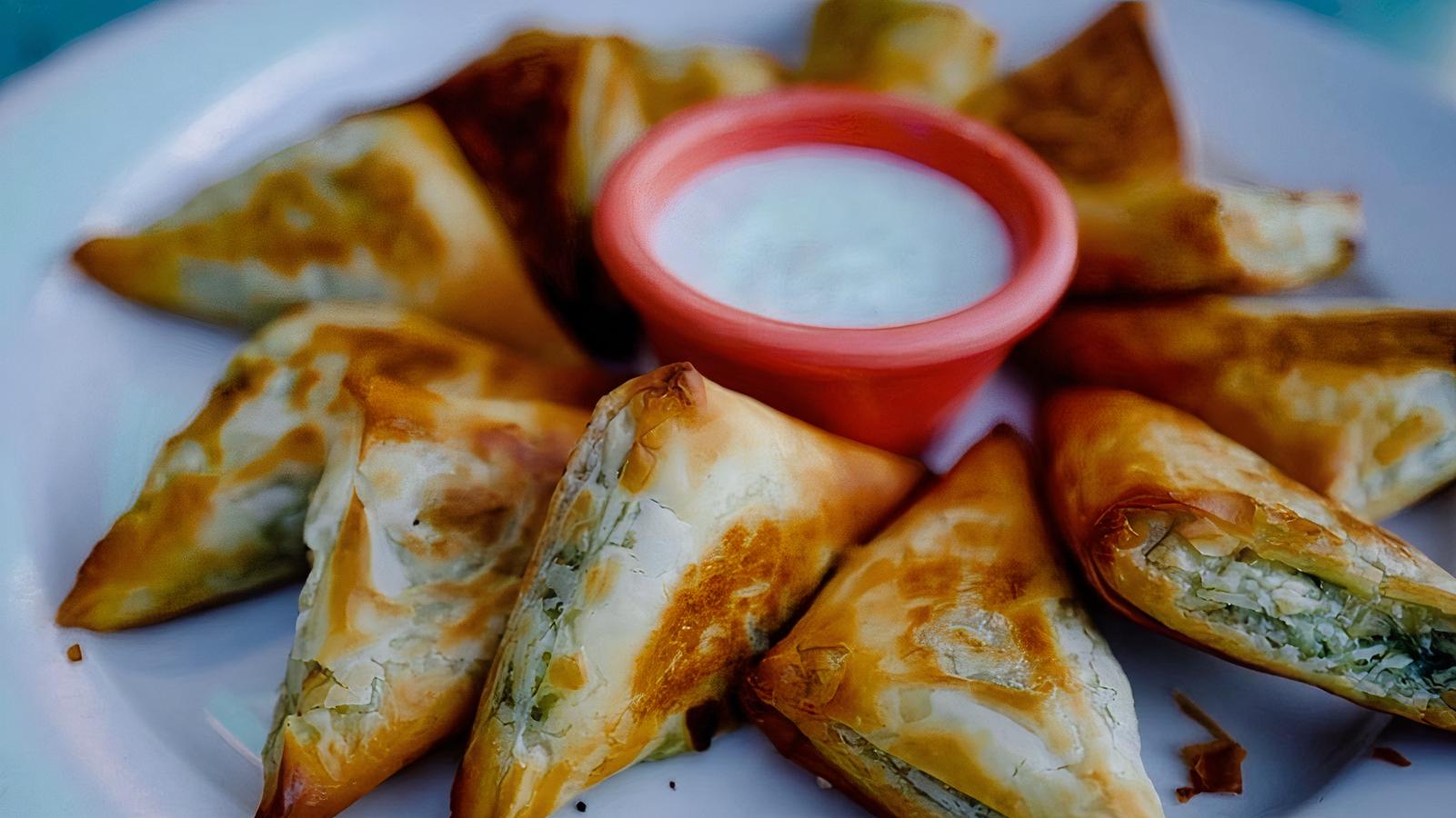 Order Spinach & Feta Triangles food online from Angelico Pizzeria and Cafe store, Washington on bringmethat.com