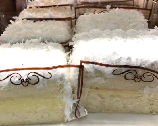 Order Large Coconut Milk Slice food online from The Pennsylvania Bakery store, Camp Hill on bringmethat.com
