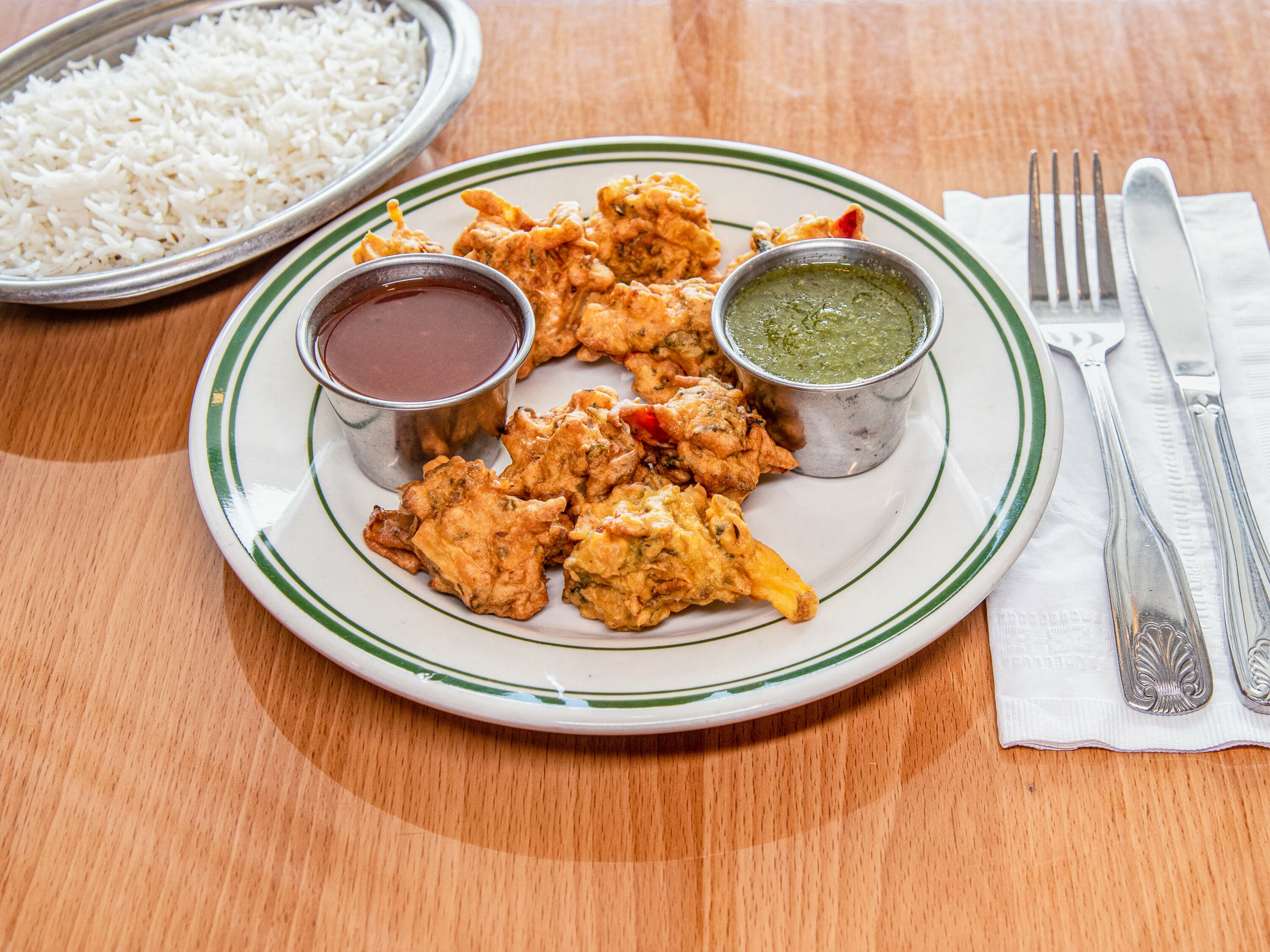 Order 4. Seven Pieces Vegetable Pakora food online from India House Restaurant store, Michigan City on bringmethat.com