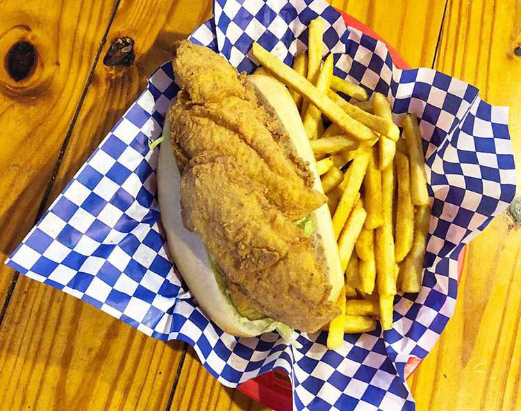 Order Fish Po Boy Sandwich food online from Cajun Crab store, Irving on bringmethat.com