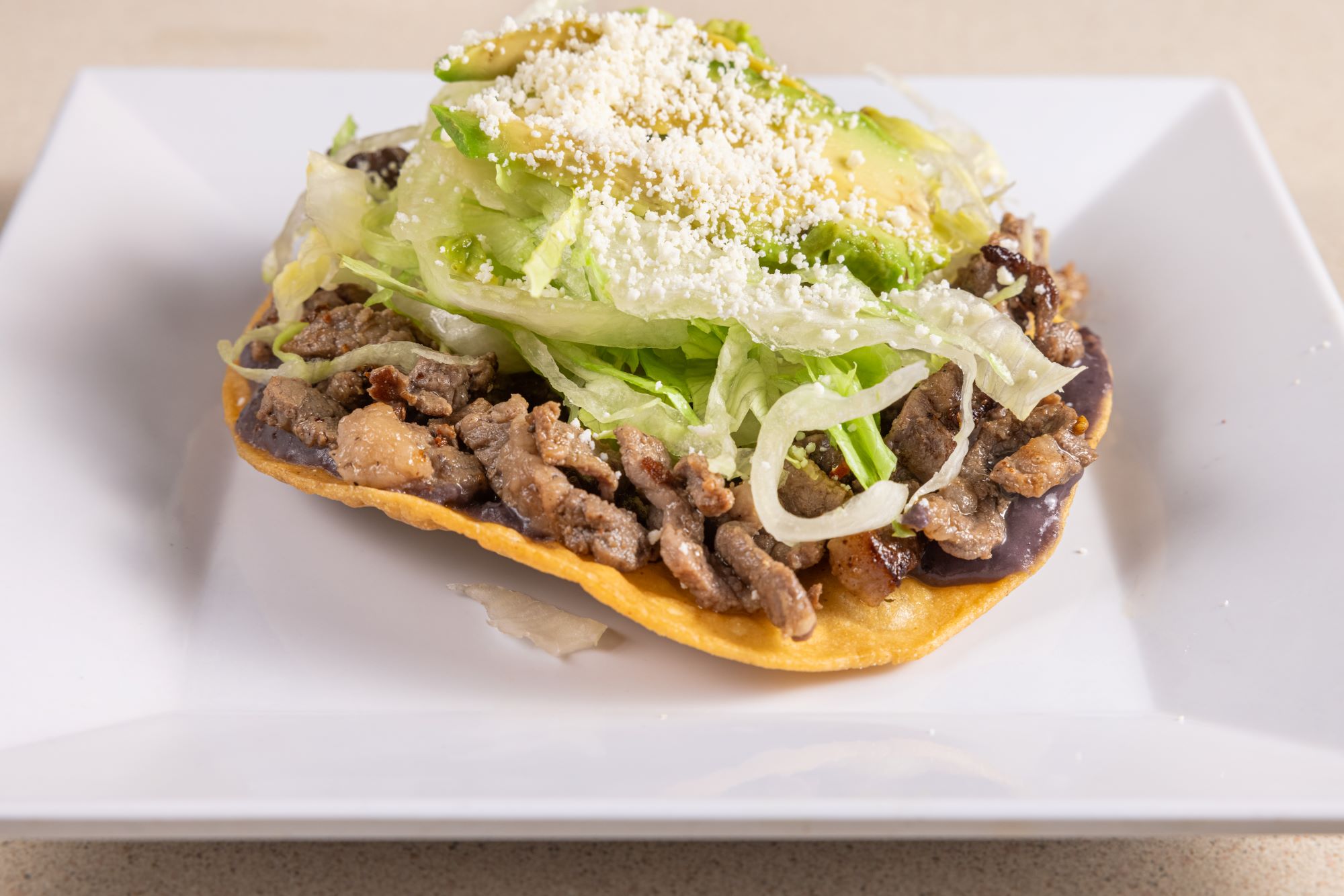 Order Steak Tostadas  food online from Homemade Taqueria store, Brooklyn on bringmethat.com