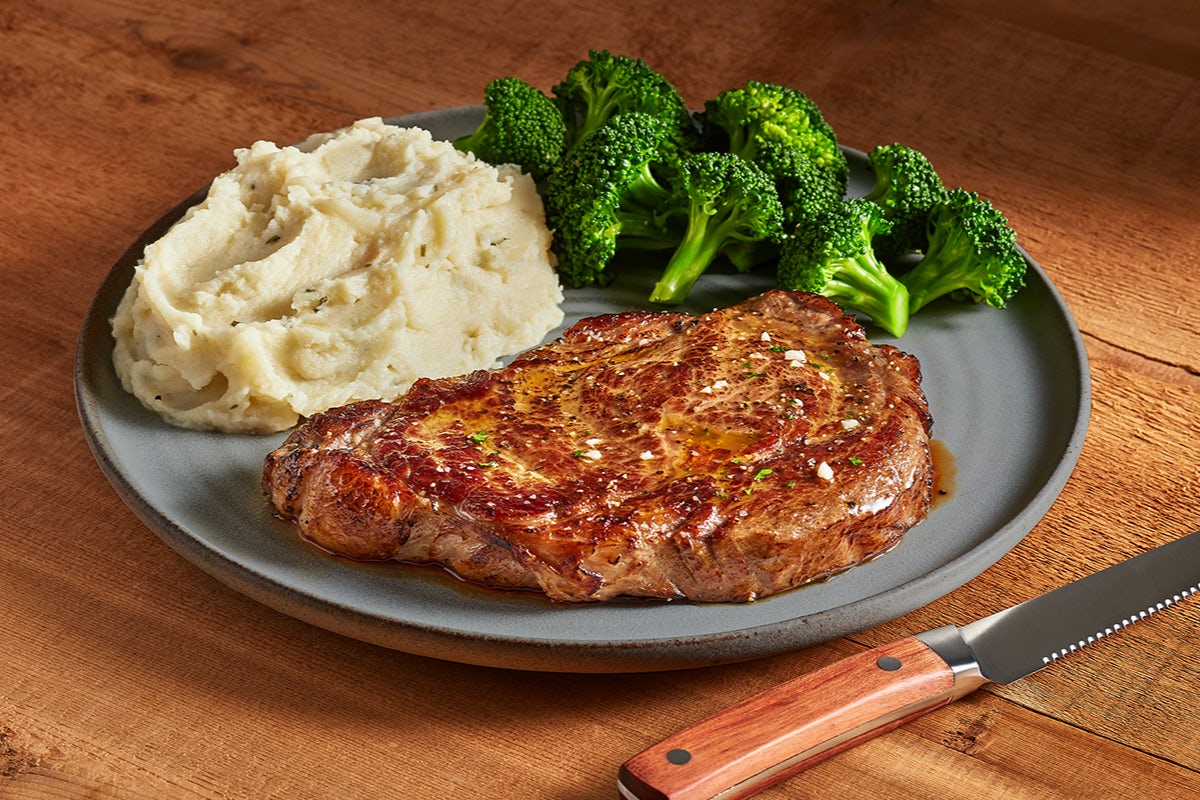 Order 12 oz Rib Eye* food online from Ruby Tuesday store, Indianapolis on bringmethat.com