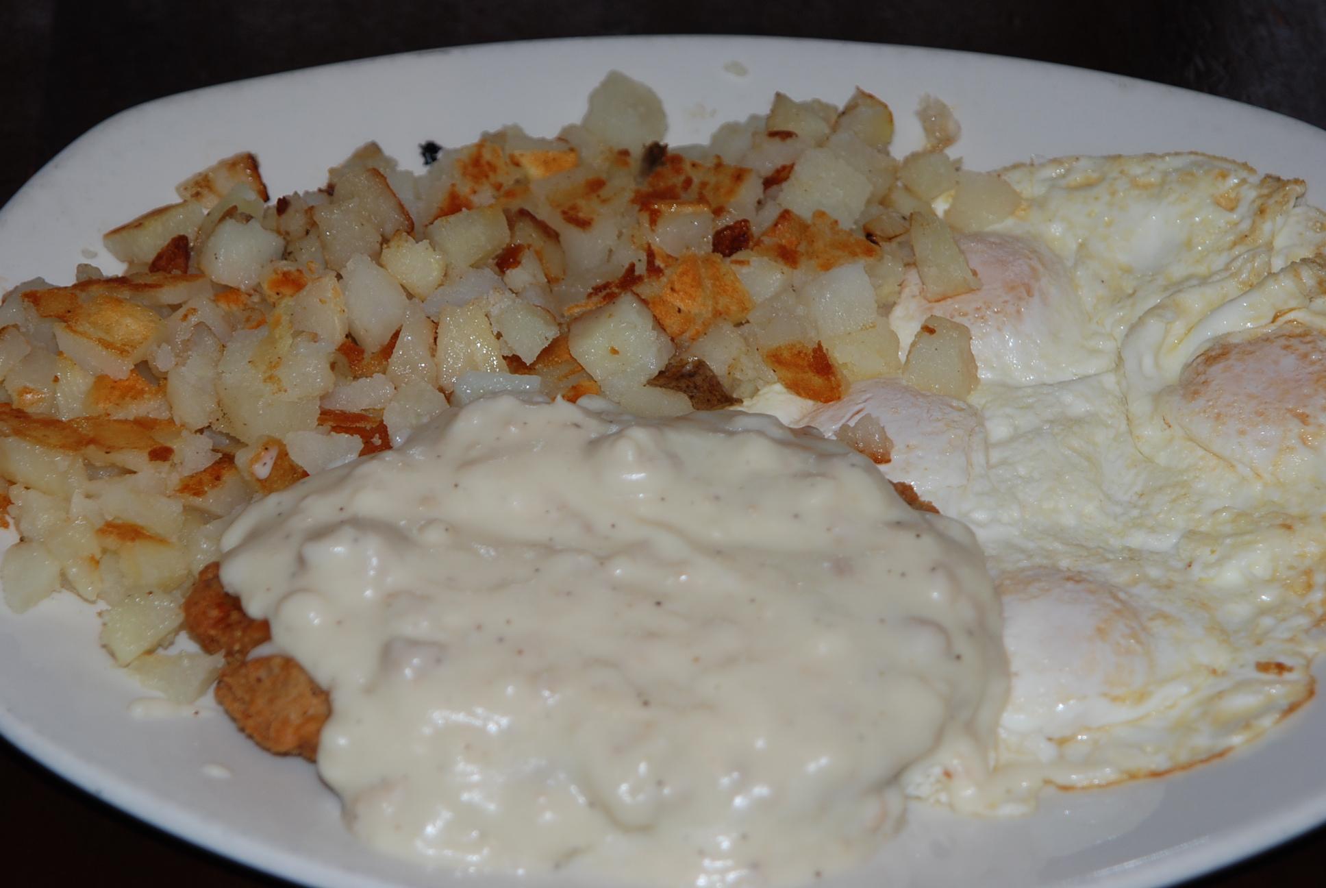 Order Country Fried Steak and Eggs food online from Blueberry Hill Breakfast Cafe store, Aurora on bringmethat.com