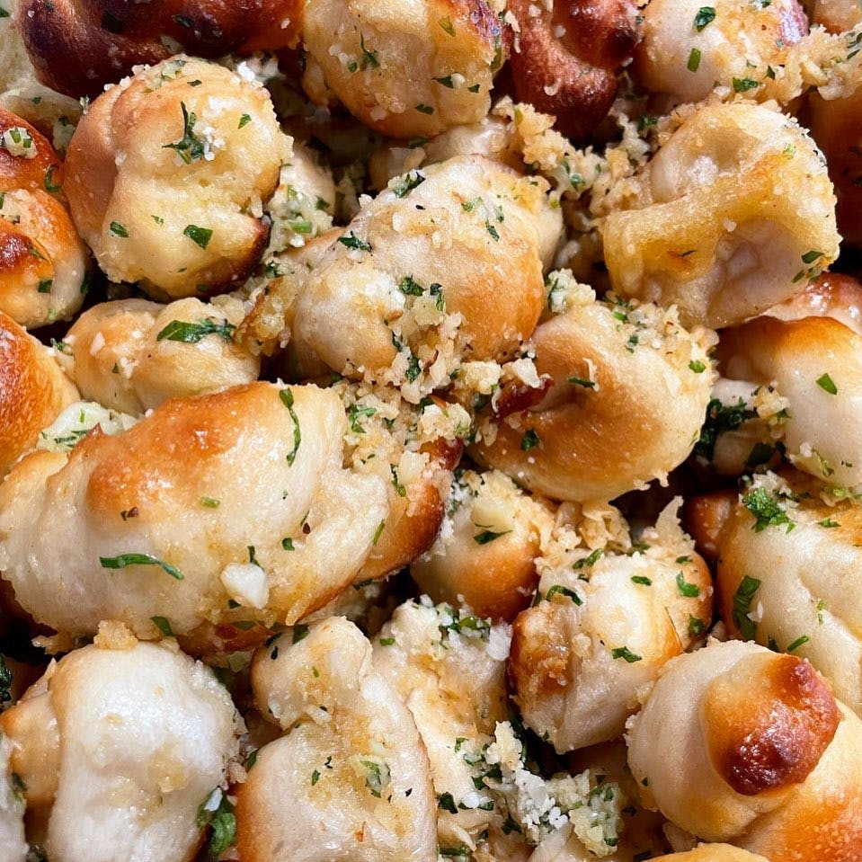 Order Garlic Knots - 6 Pieces food online from Whippany Pizzeria store, Whippany on bringmethat.com