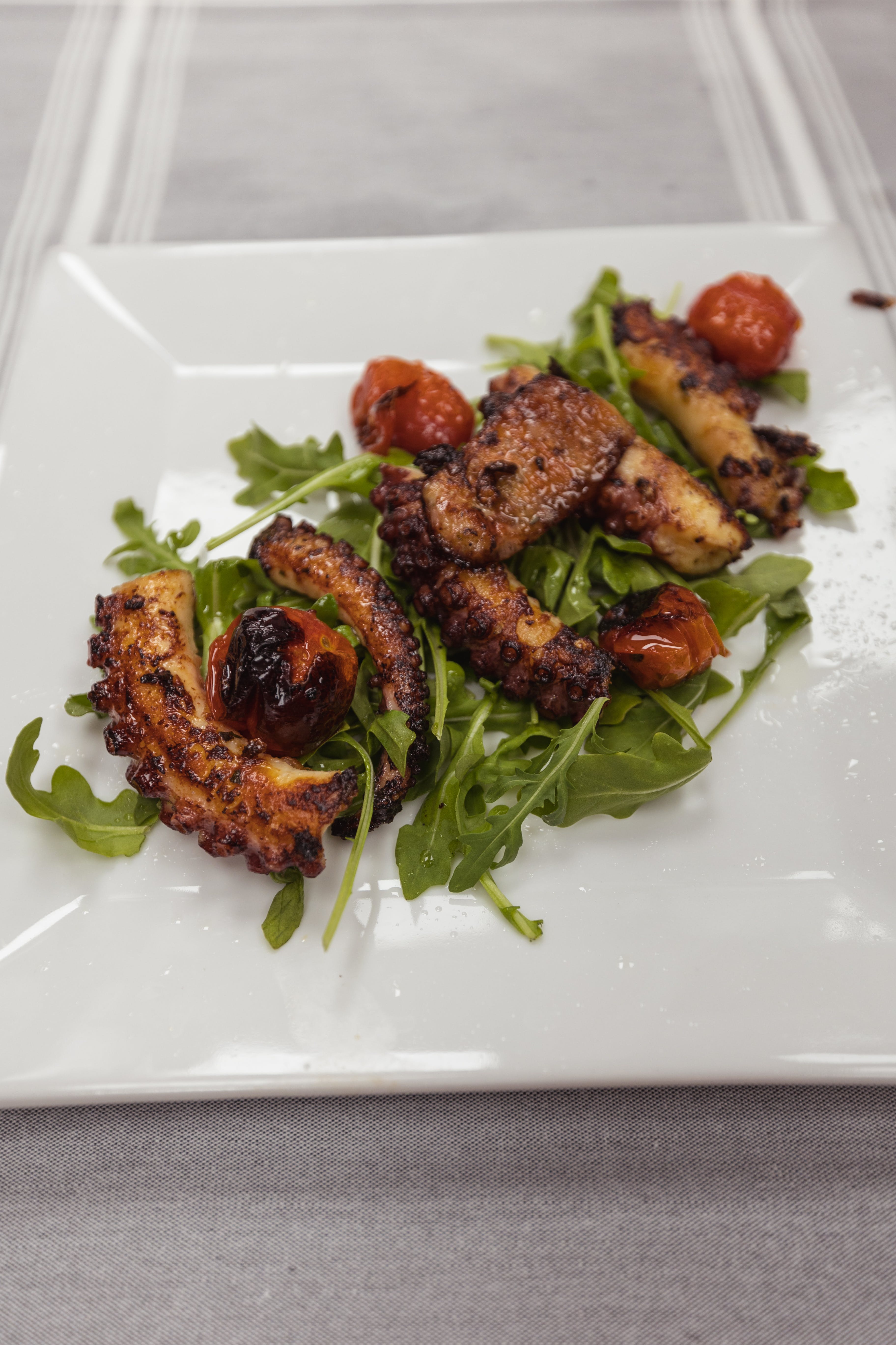 Order Grilled Octopus - Grilled Octopus food online from Rocco's Of Roc Beach store, Rockaway Park on bringmethat.com
