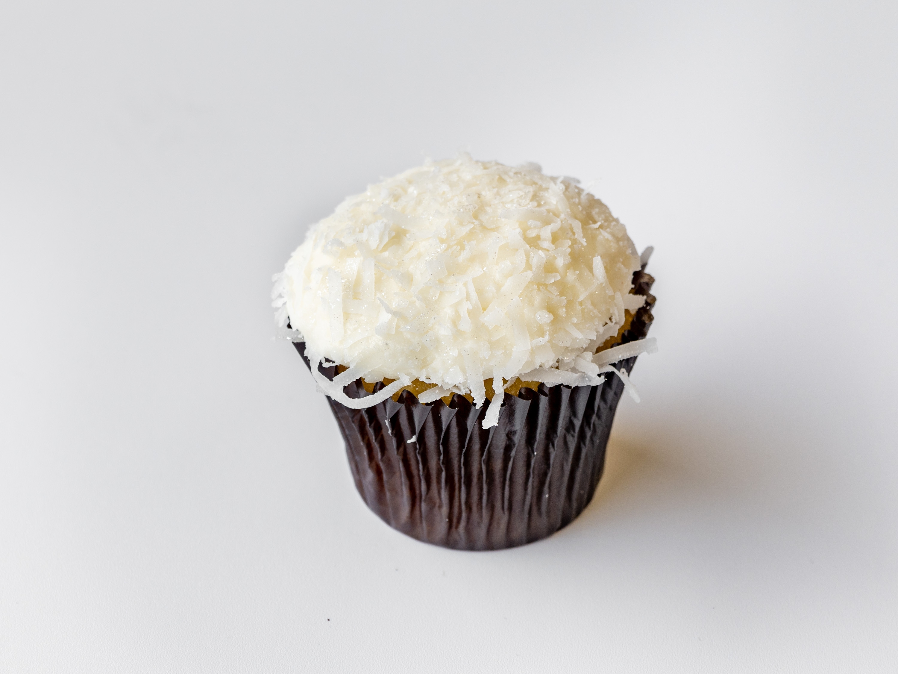 Order Coconut Classic Cupcake food online from Yummy Cupcakes store, Encinitas on bringmethat.com