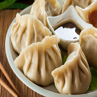 Order 12. Steamed Dumpling food online from Great China store, Madison on bringmethat.com