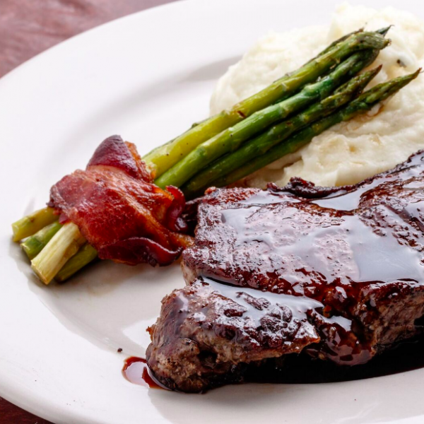 Order Delmonico Steak food online from Tuscany Bistro store, League City on bringmethat.com