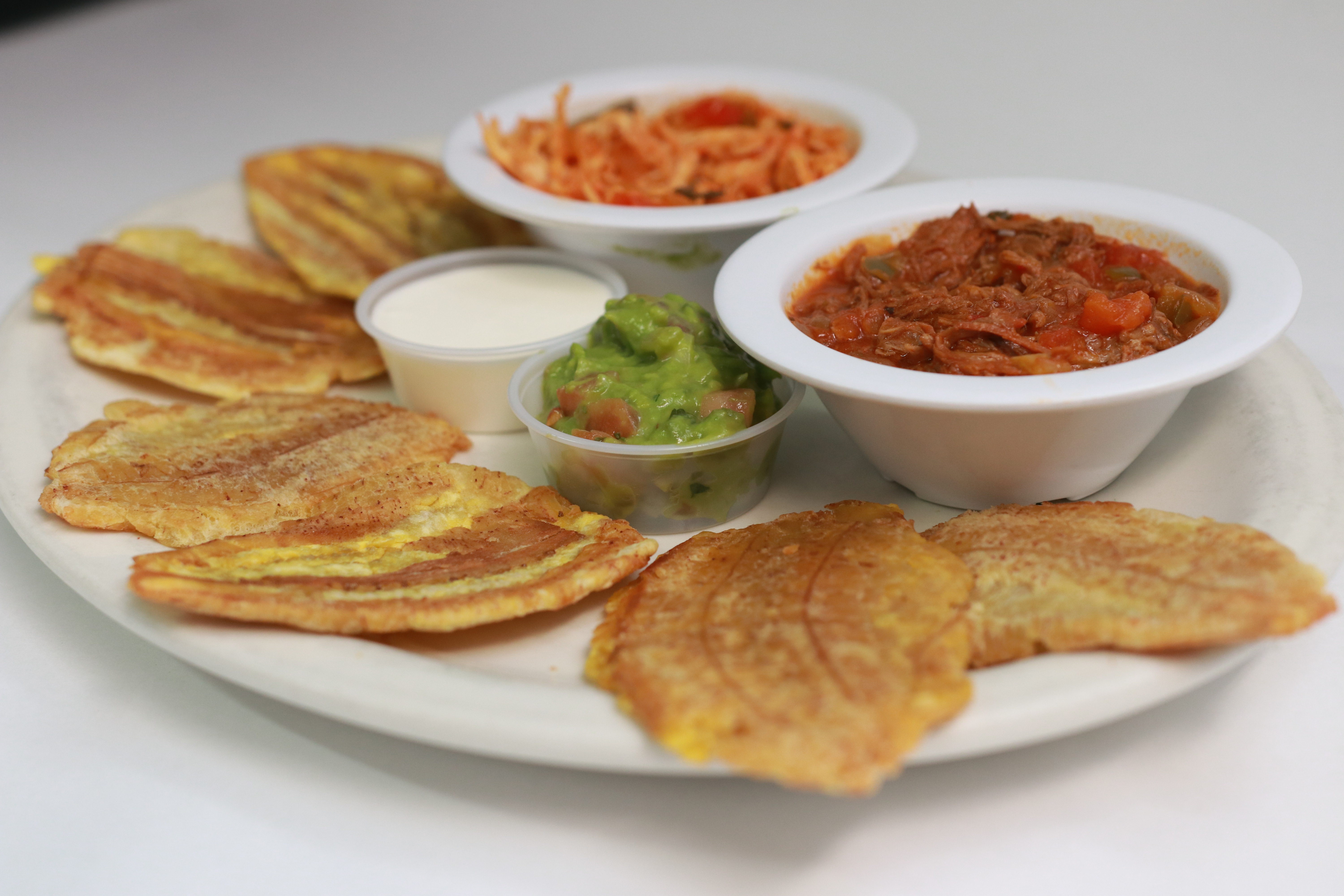 Order Tostones con Todo food online from Empanadas & More store, Smithtown on bringmethat.com