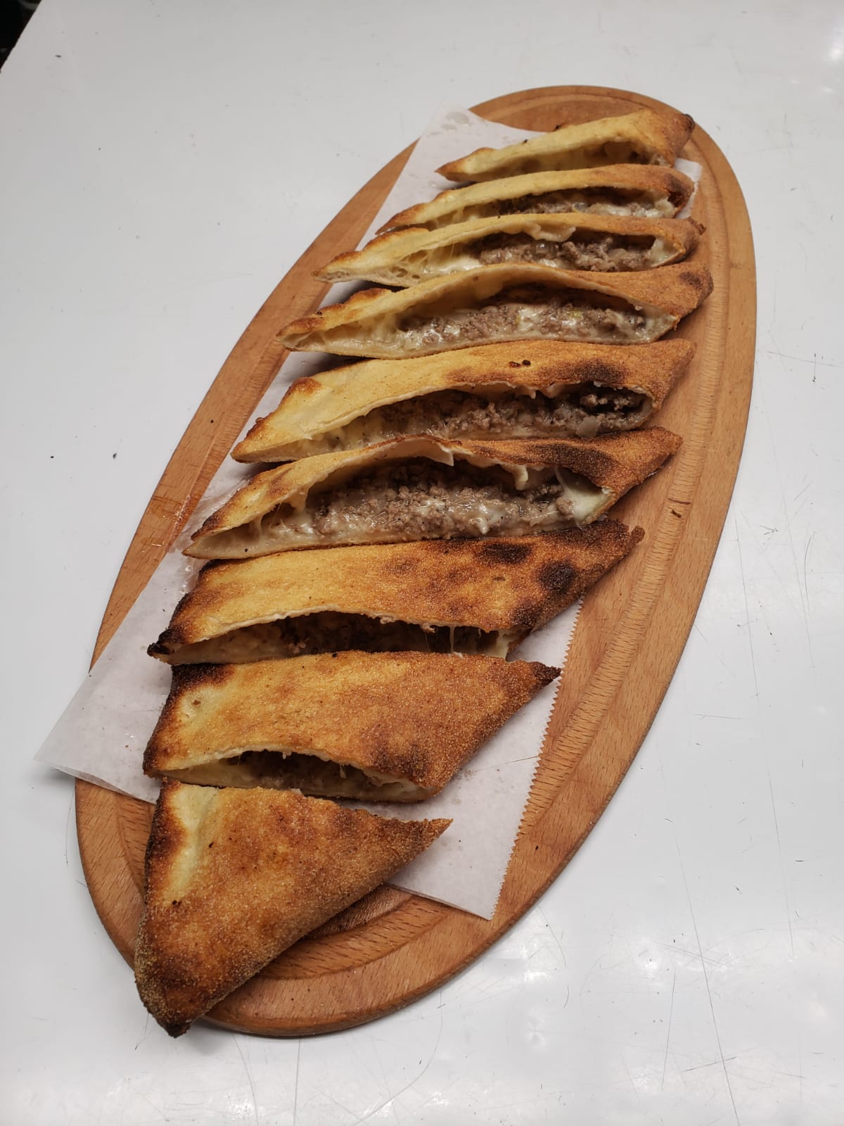 Order 31. Bafra Pide food online from Mosaic Cafe Eatery store, Virginia Beach on bringmethat.com