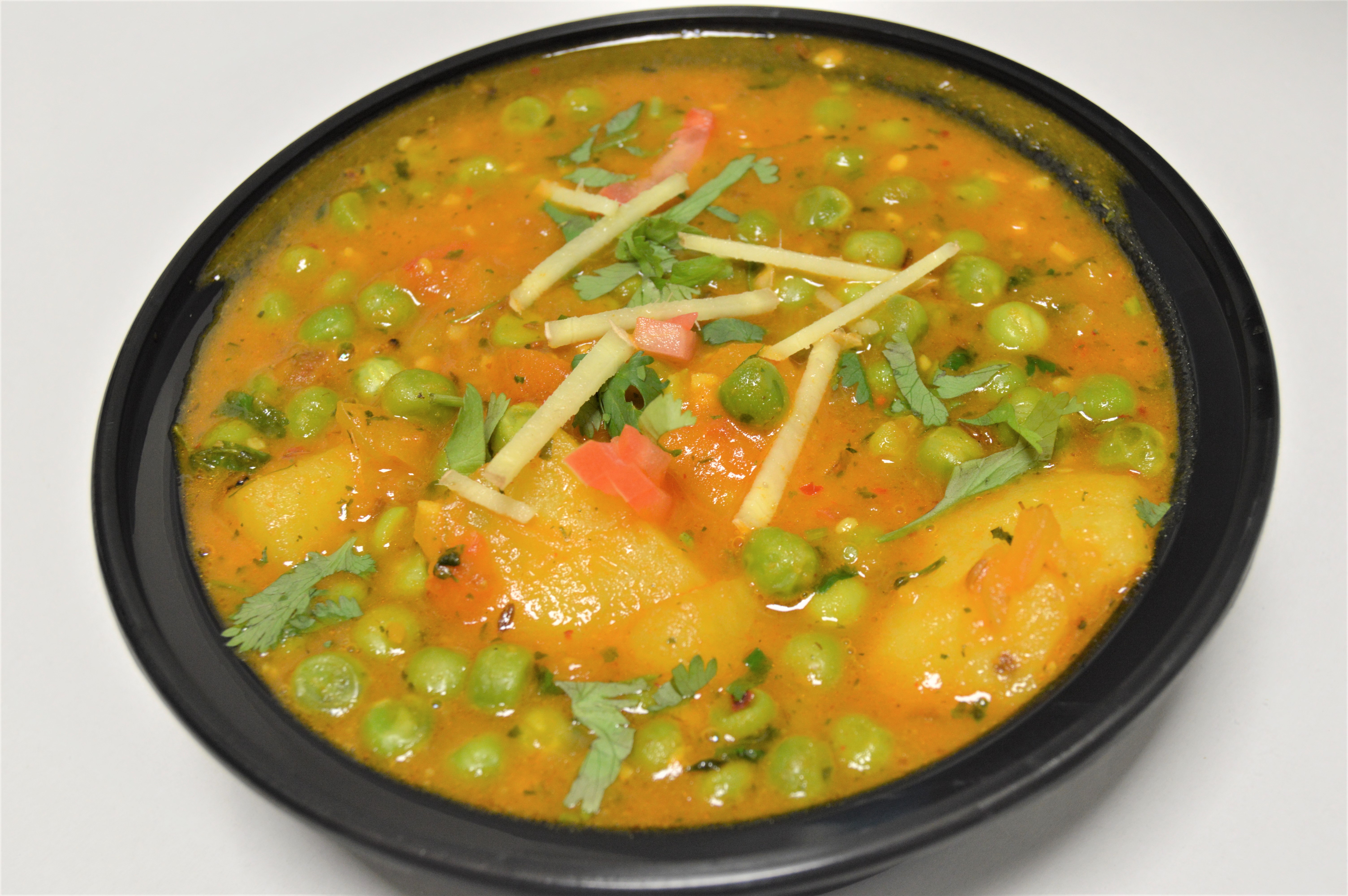 Order 63. Aloo Mutter food online from Salt And Pepper Grill Iii store, Washington on bringmethat.com