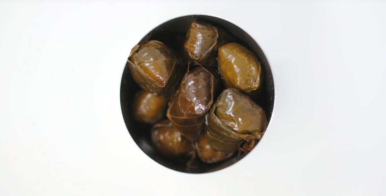 Order Grape Leaves (6pc) food online from Greens And Grains store, Galloway on bringmethat.com