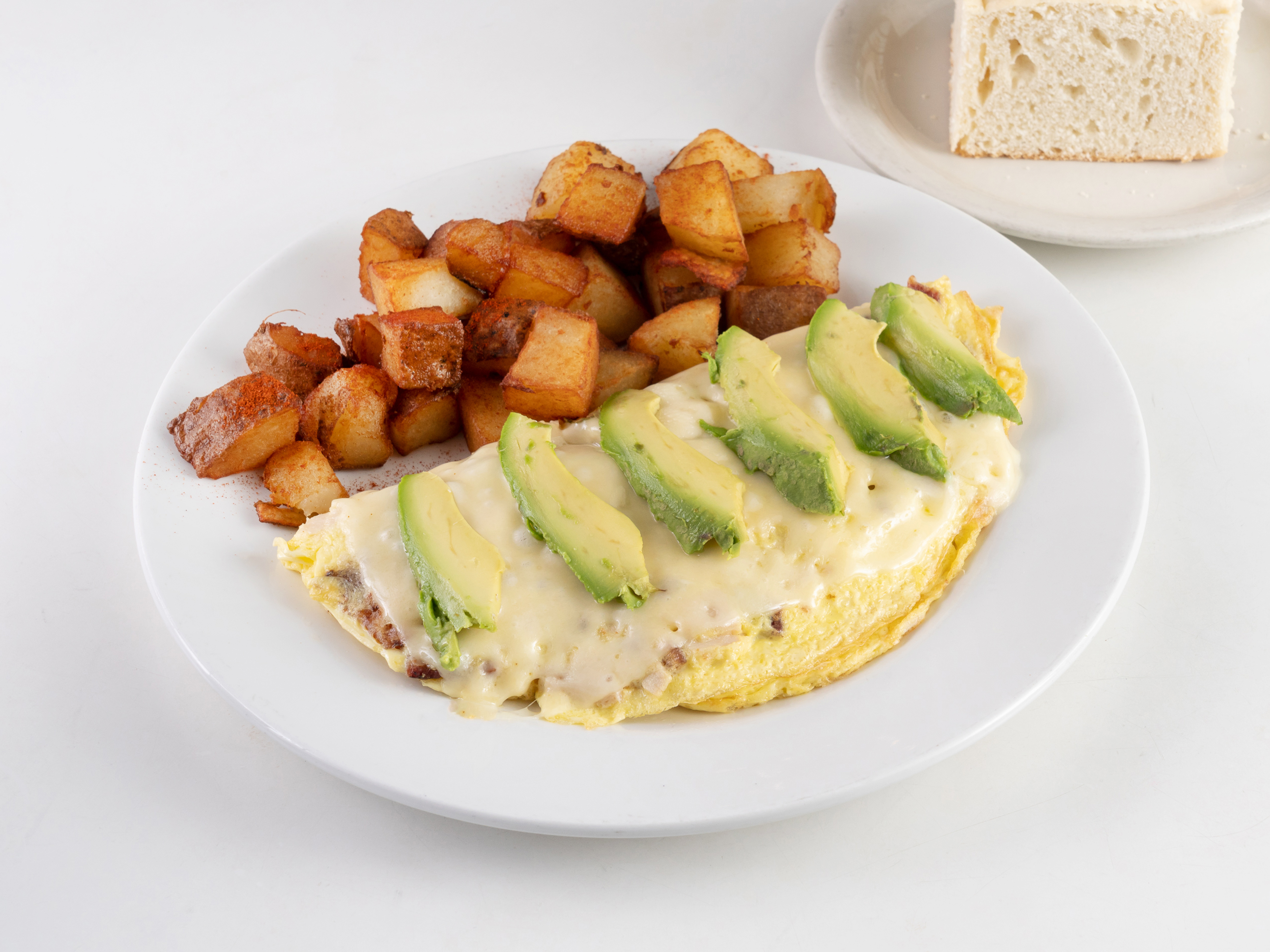 Order Turkey, Bacon and Avocado Omelette food online from Victor's Deli and Restaurant store, Houston on bringmethat.com